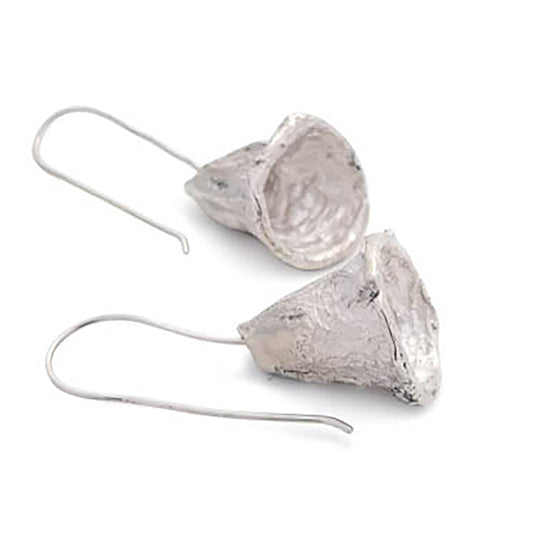 Explore the Bells Sterling Silver Earrings by FR | Art Jewellery, a pair of beautifully crafted earrings featuring a unique bell-like design. Each earring has a curved, hook-style ear wire for comfortable wear and showcases a rustic, artisanal finish that enhances their distinctive look.