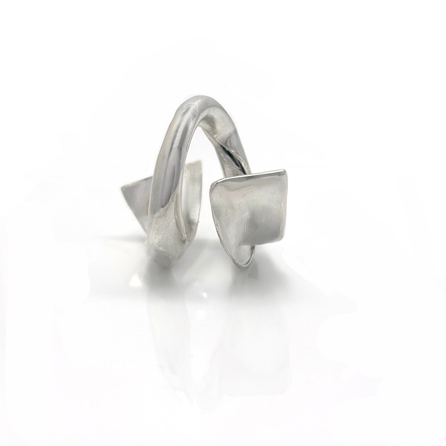 Handcrafted sterling silver ring with a fluid, convex sculptural design inspired by ocean movement – FR Art Jewellery. front look