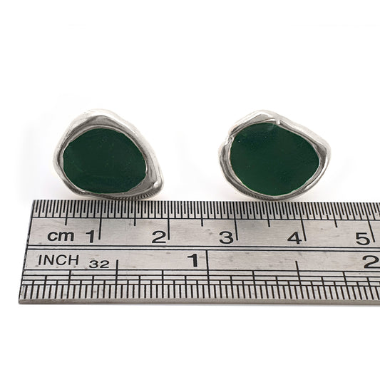 Introducing the "Drop of Colours Studs" from FR | Art Jewellery: a collection of small, round sterling silver earrings with vibrant stones. This set features pairs in an array of shades—two red, one black, one green, one yellow, and one blue—beautifully arranged on a white background.