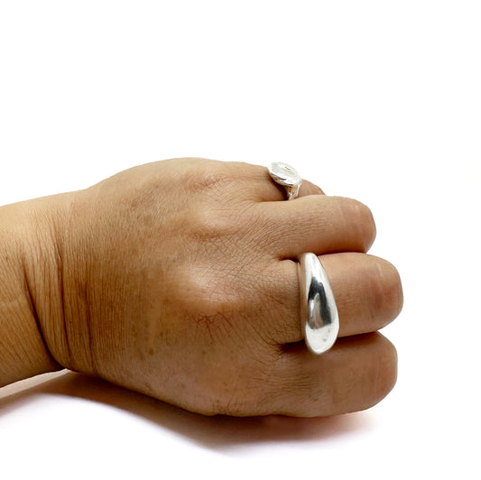 The Ebbs & Flows Rings - Central Sterling Silver by FR | Art Jewellery features a smooth, organic asymmetrical design with a rounded top and tapered band, creating a modern, minimalist handmade look.