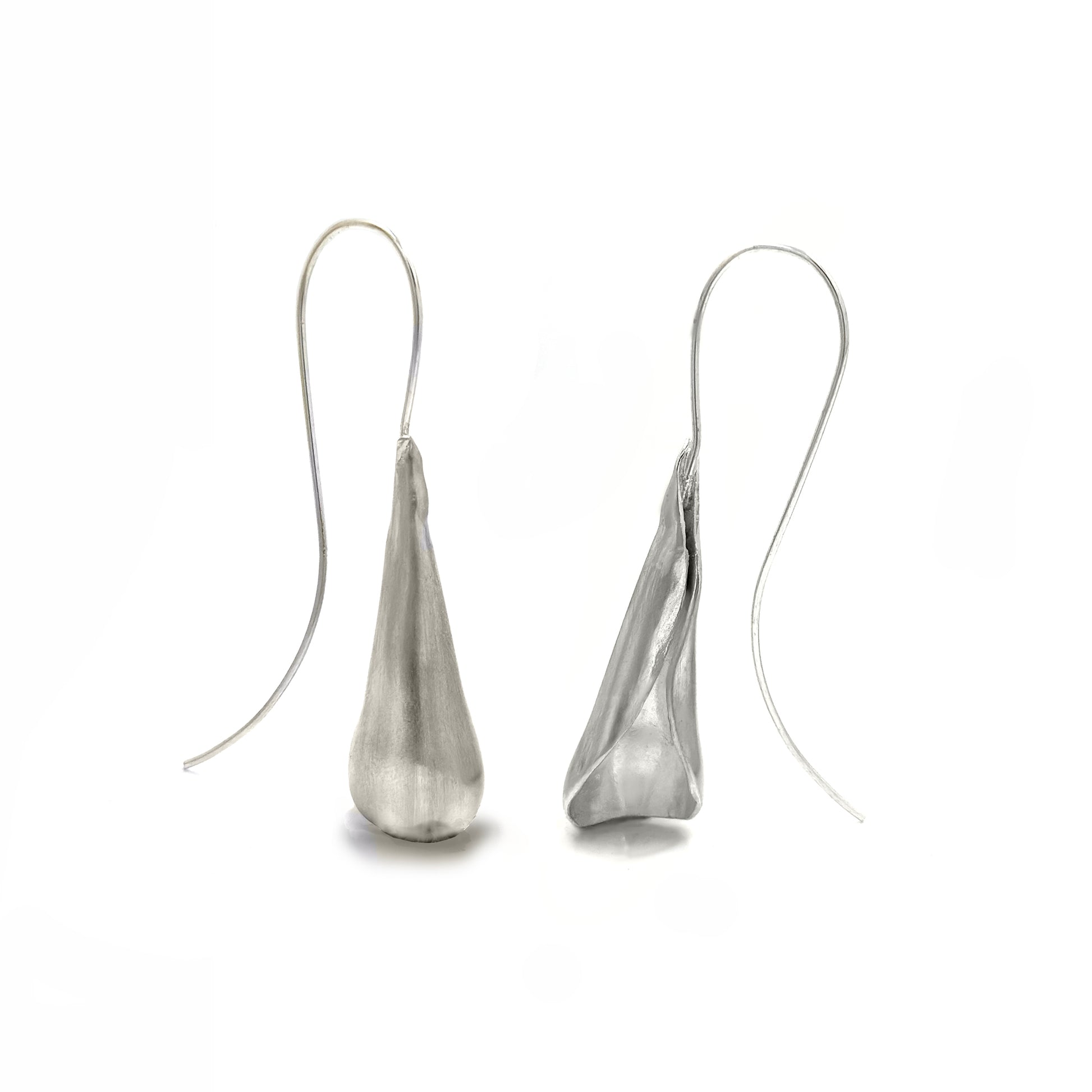 The Ebbs & Flows Earrings – Medium by FR | Art Jewellery are handcrafted sterling silver earrings featuring smooth, organic teardrop pendants and long curved hooks, shown against a white background.