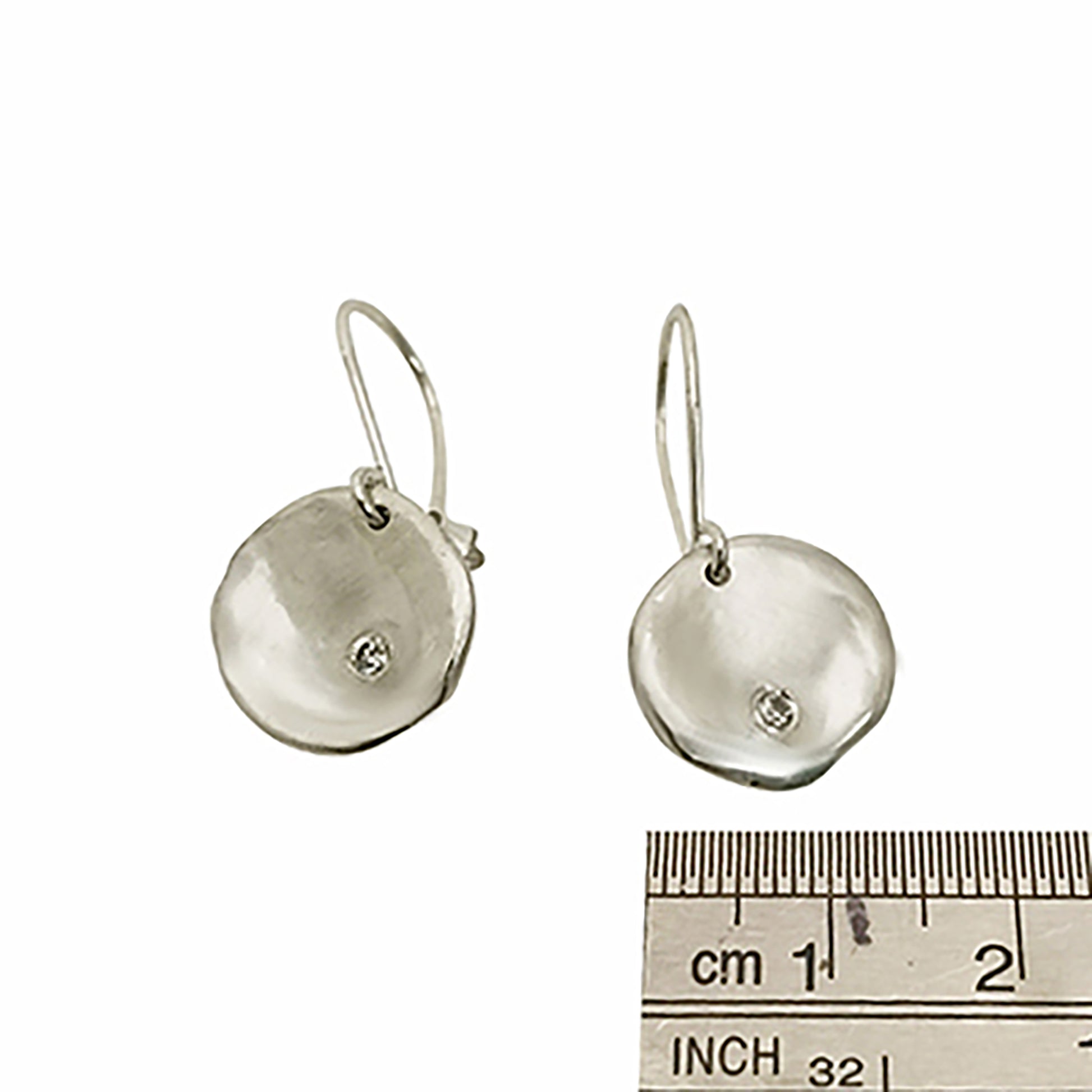 Explore the Full Moon Sterling Silver and Gold Earrings from FR | Art Jewellery's Lunar Collection. This handcrafted jewelry features gold oval shapes adorned with a central round diamond. The elegant hook design ensures effortless wear, beautifully highlighted against a plain white background.