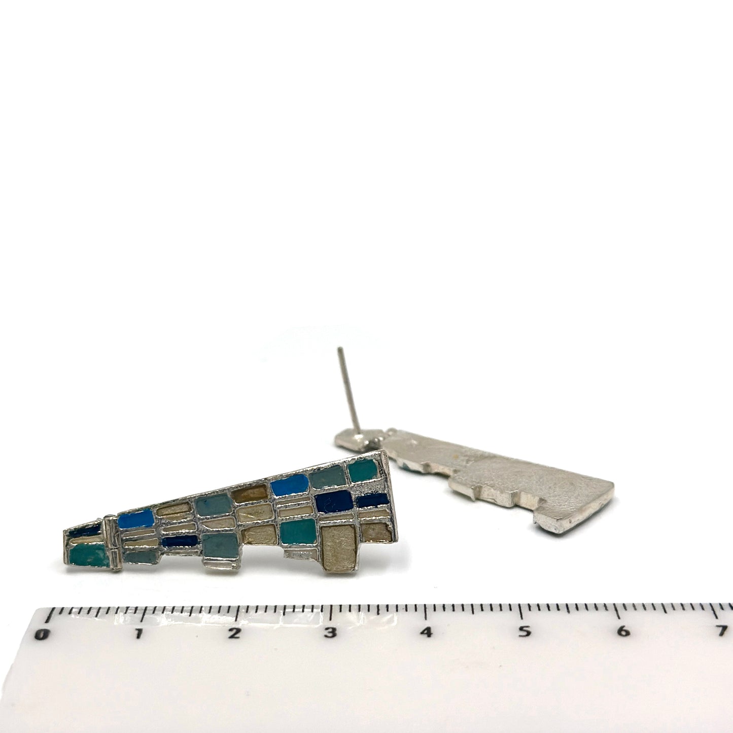 The Klimt Earrings by FR | Art Jewellery feature geometric building-inspired shapes in enamel-painted sterling silver, with blue, turquoise, gold, and white inlays. Displayed on a white background.