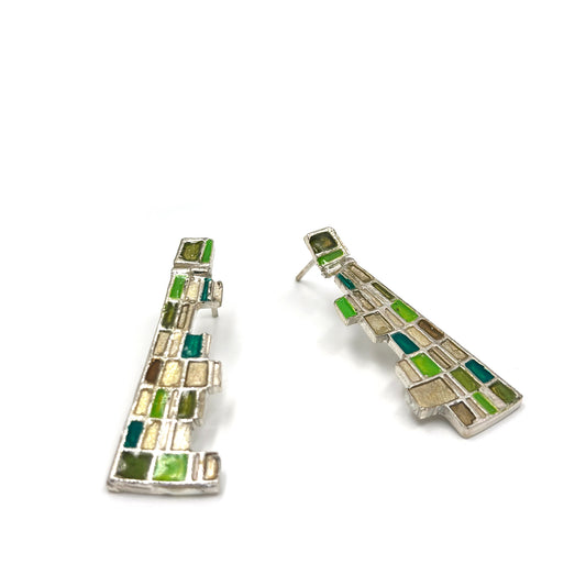 The Klimt Earrings by FR | Art Jewellery feature geometric building-inspired shapes in enamel-painted sterling silver, with blue, turquoise, gold, and white inlays. Displayed on a white background.