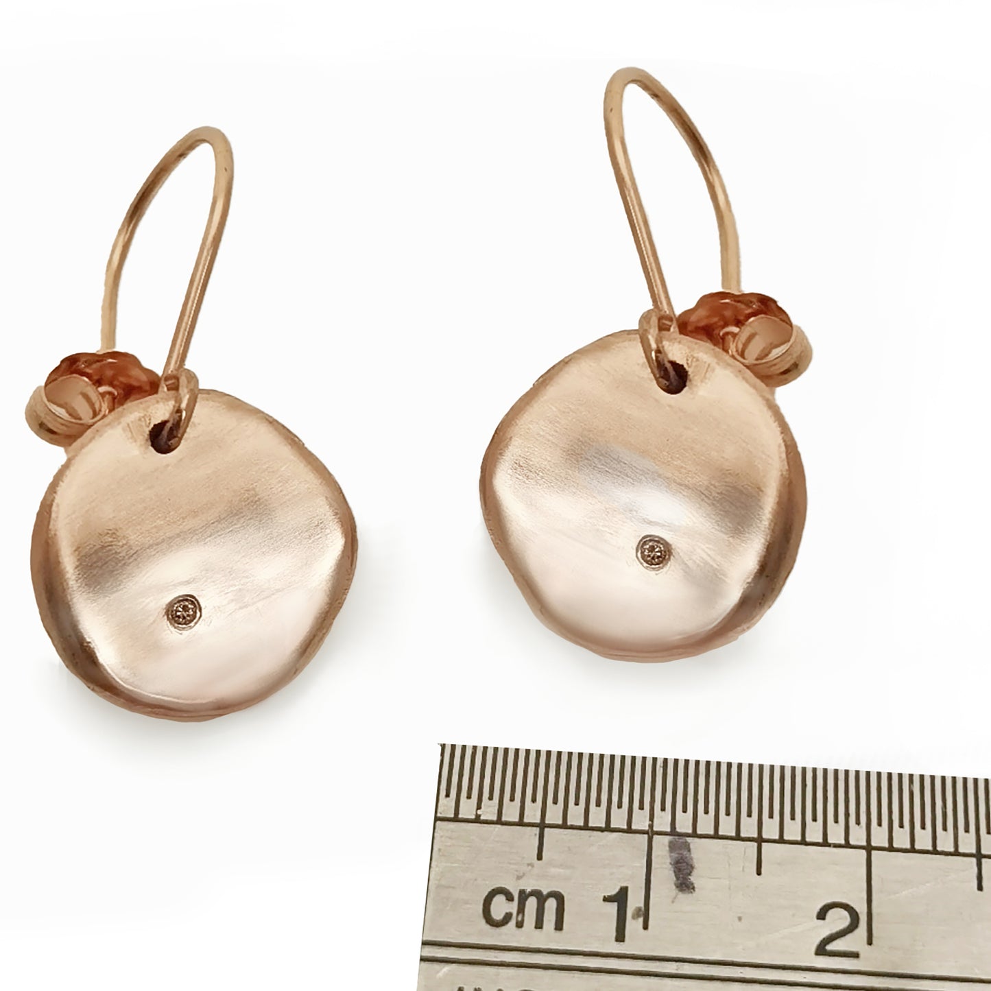 Explore the Full Moon Sterling Silver and Gold Earrings from FR | Art Jewellery's Lunar Collection. This handcrafted jewelry features gold oval shapes adorned with a central round diamond. The elegant hook design ensures effortless wear, beautifully highlighted against a plain white background.