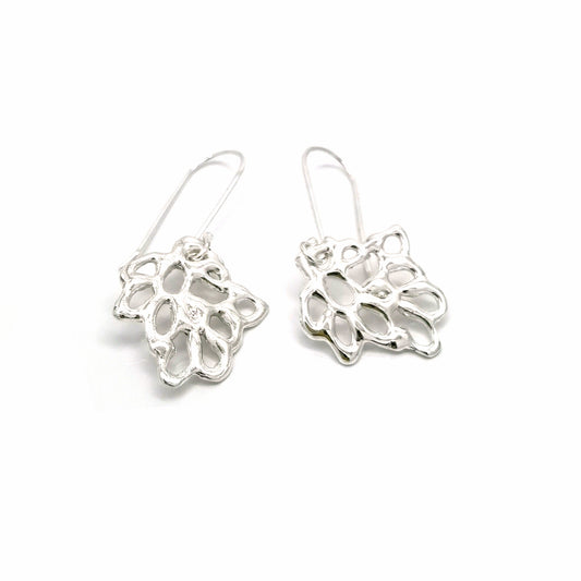 The Maple Sterling Silver Earrings by FR | Art Jewellery feature intricate openwork leaf designs, showcasing exquisite handmade craftsmanship. These elegant filigree dangle earrings are beautifully displayed against a white background.