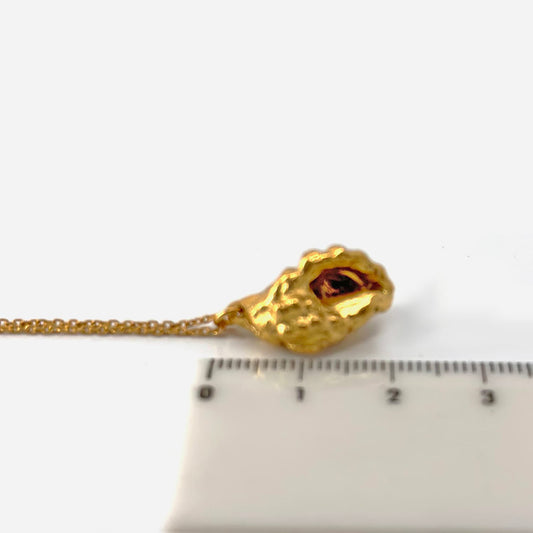 The My worldious Necklace in Sterling Silver by FR | Art Jewellery features a delicate chain and an artful, textured pendant inspired by the shape of an irregular nugget, shown against a white background.