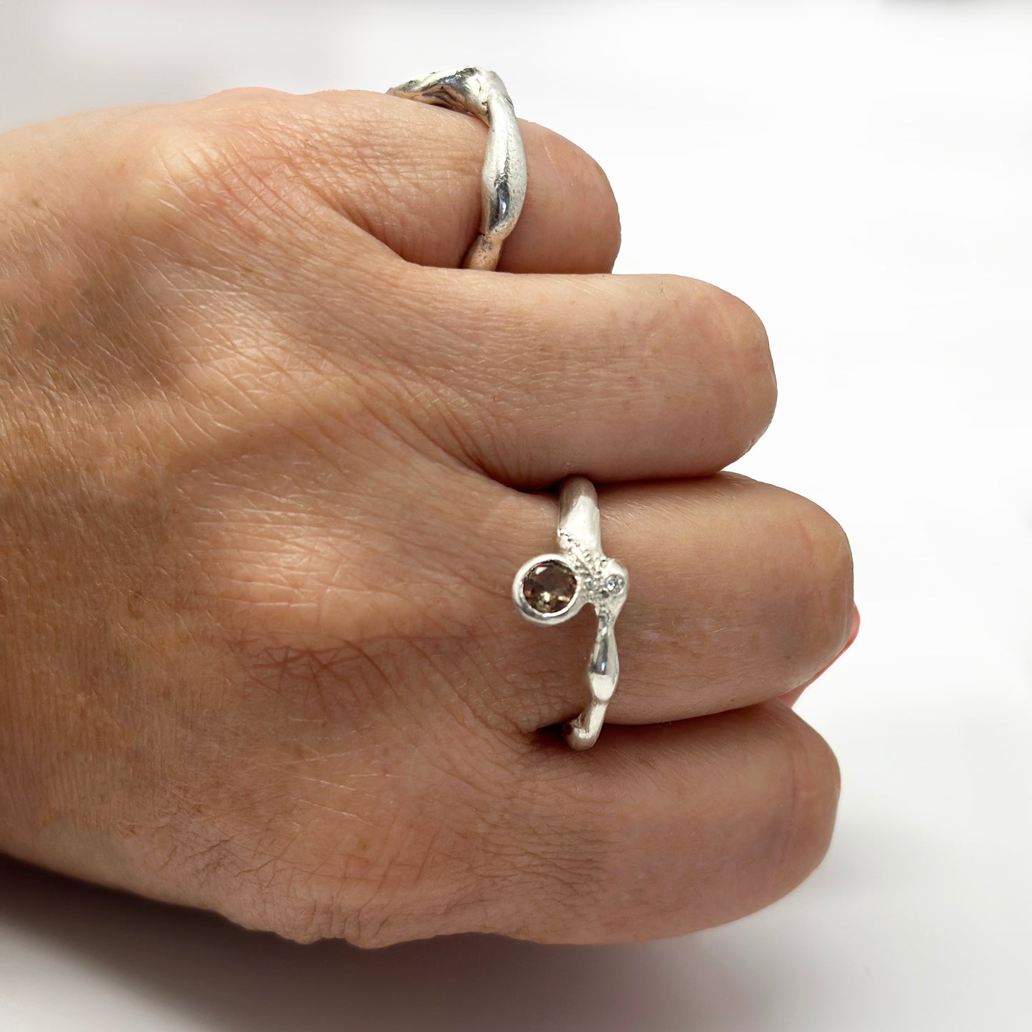 Handmade sterling silver ring with rutilated quartz and white diamond by FR | Art Jewellery, Sydney – organic sculptural design with open band and natural gemstone detail.