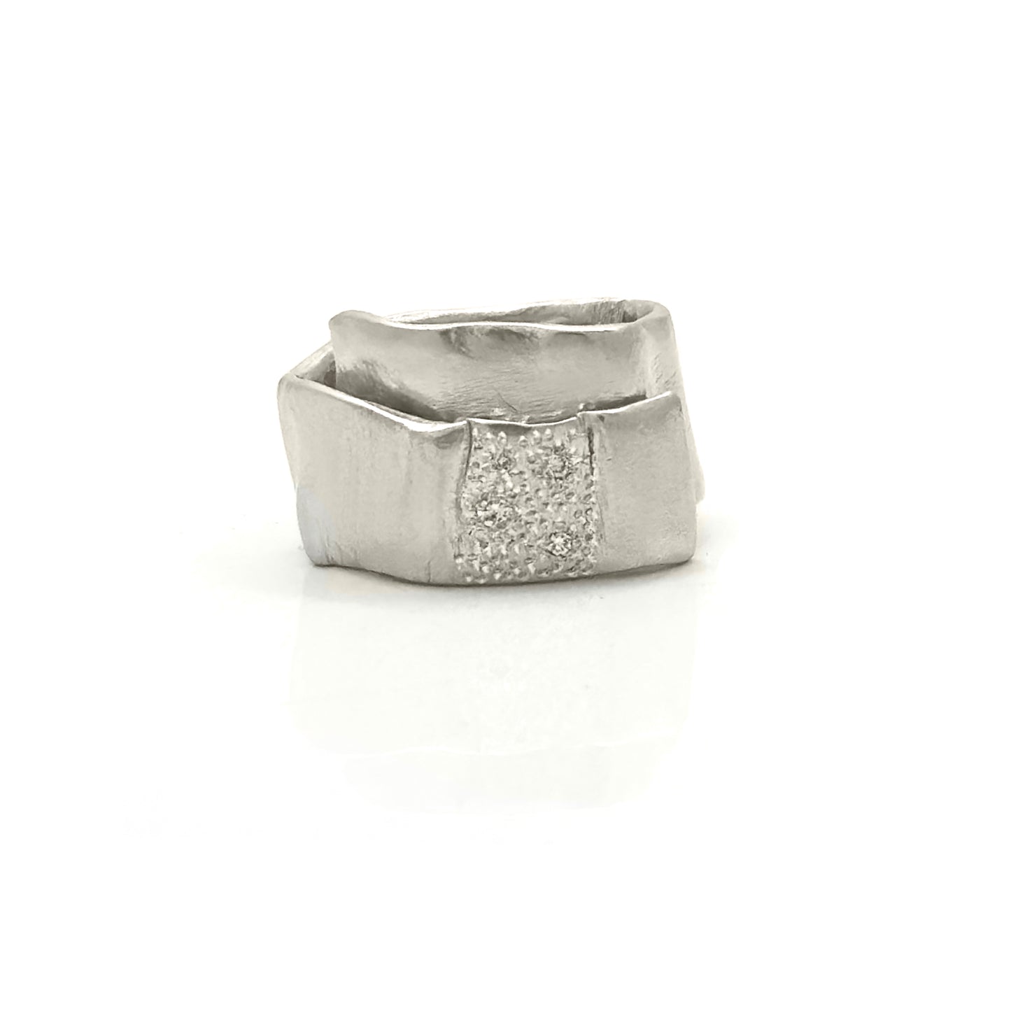 The Spiral Diamond Ring – Sterling Silver by FR | Art Jewellery features a modern geometric design with an angular band and a textured center set with sparkling stones—a handcrafted statement piece.