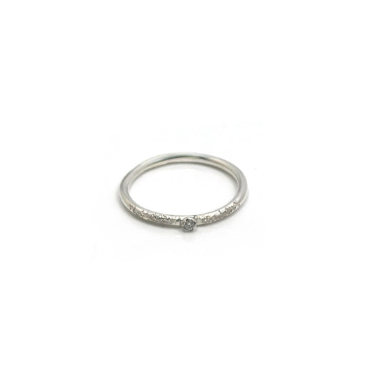 The Tinytoo Sterling Silver Ring with Diamond Gemstone by FR | Art Jewellery features a small central diamond and tiny diamonds on the band, shown against a plain white background.