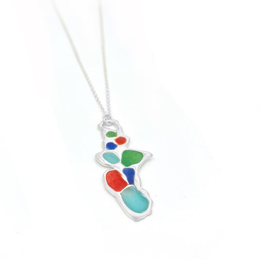 A silver chain necklace from FR | Art Jewellery, the Vitro Colours Necklace features a colorful abstract pendant with irregularly shaped sections in vibrant hues including red, green, blue, and turquoise.