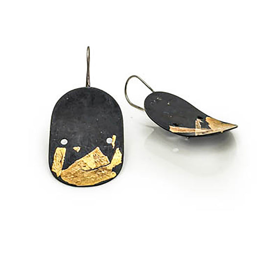 Introducing the Curva.dos Sterling Silver Earrings by FR | Art Jewellery: These oval earrings showcase a matte black finish, adorned with abstract gold leaf accents crafted using the Keum Boo technique. Each earring is designed with a delicate sterling silver hook for easy wear.