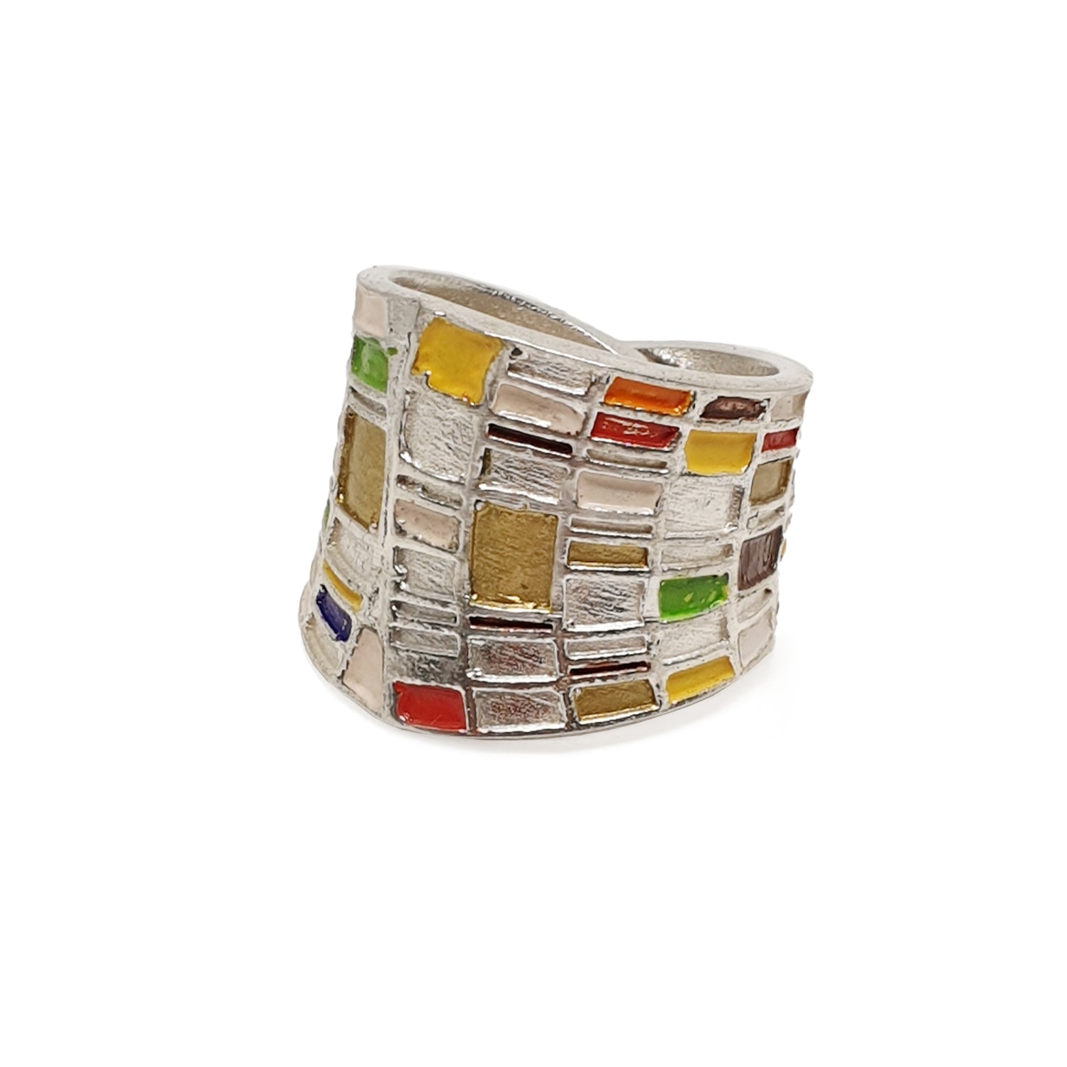 A wide silver ring adorned with colorful, rectangular mosaic-like inlays in shades of red, yellow, green, blue, and brown, arranged in an abstract pattern.