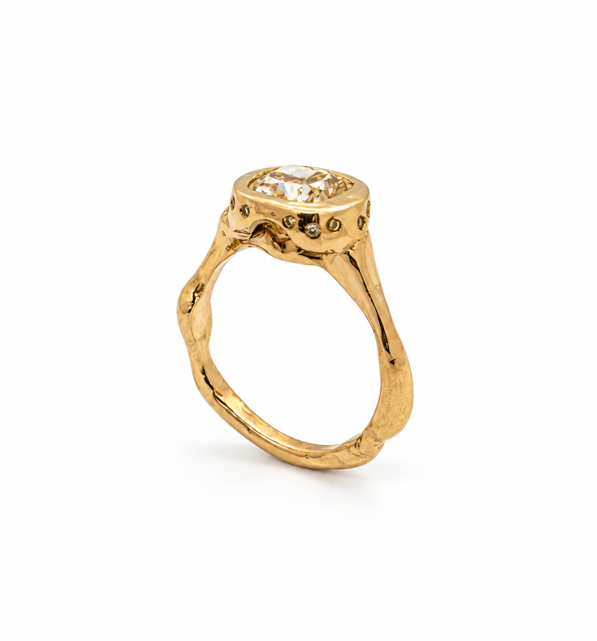 Angled view of a sculptural organic 9ct gold ring with a yellow cushion lab-grown diamond and 14 small diamonds around the setting, handmade in Sydney