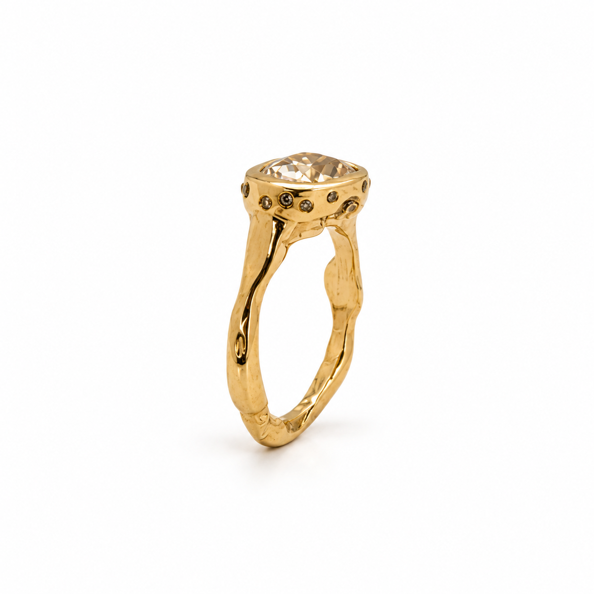 Side view of a handmade 9ct yellow gold yellow diamond ring showing its textured, organic band and scattered 1mm diamonds