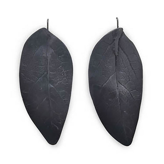 Introducing the Black Leaf Earrings by FR | Art Jewellery: a stunning pair of dark, leaf-shaped earrings featuring intricate vein patterns that mimic real leaves. Each handcrafted piece is designed for secure fastening with a hook, showcasing a unique design where the left earring has a gently curved shape and the right one remains more flat and straight.