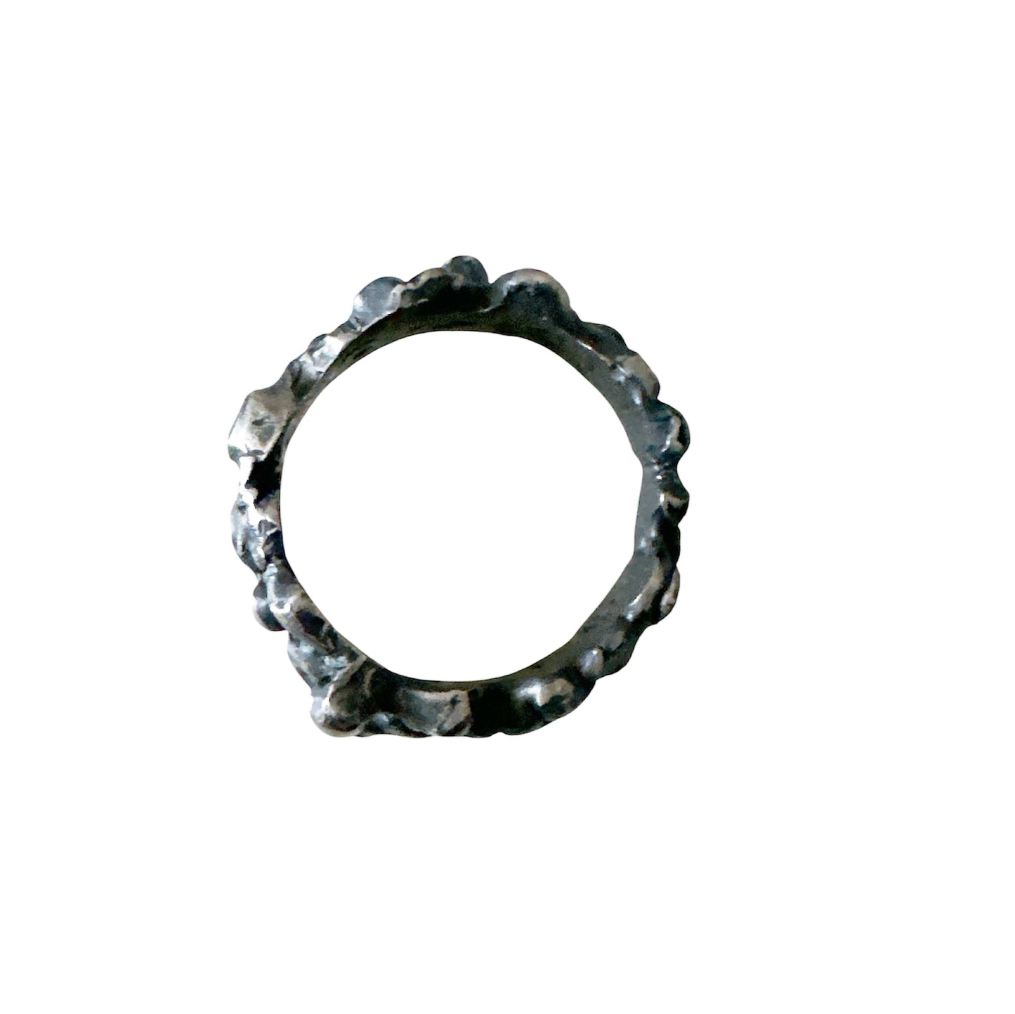 The Bottom Of The Sea Ring by FR | Art Jewellery is a sterling silver ring with an uneven, textured, organic surface, inspired by contemporary art jewellery. Displayed on a white background.