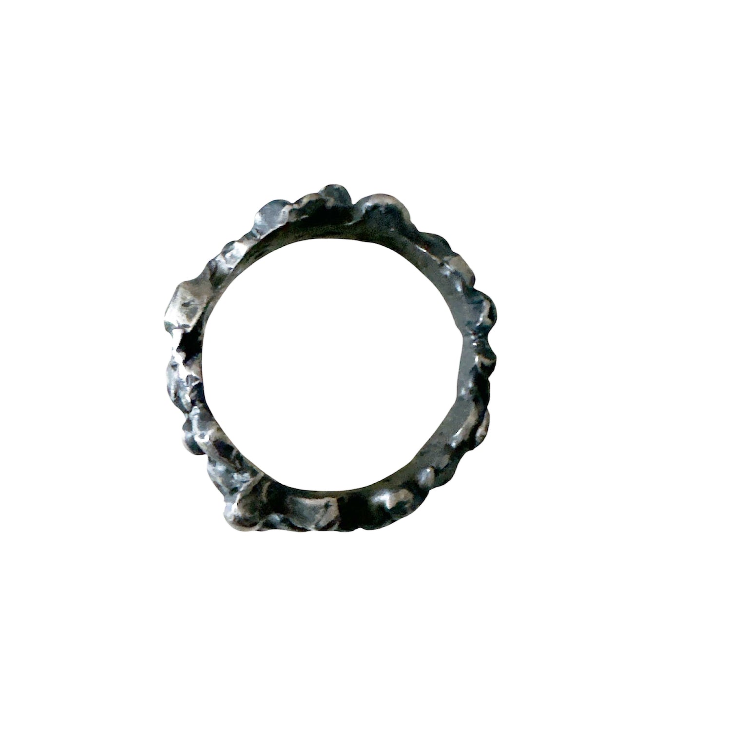The Bottom Of The Sea Ring by FR | Art Jewellery is a sterling silver ring with an uneven, textured, organic surface, inspired by contemporary art jewellery. Displayed on a white background.