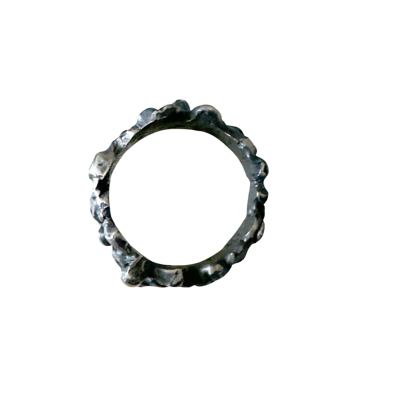 The Bottom Of The Sea Ring by FR | Art Jewellery is a sterling silver ring with an uneven, textured, organic surface, inspired by contemporary art jewellery. Displayed on a white background.
