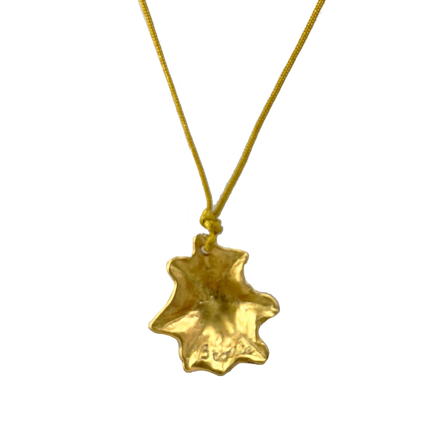 The Bronte Shell I Necklace by FR | Art Jewellery is a stunning piece featuring a gold pendant shaped like a star-shaped leaf, hanging from a delicate gold chain. This handmade jewellery shines brilliantly and is perfect for those who appreciate artisanal craftsmanship. The background is plain white.