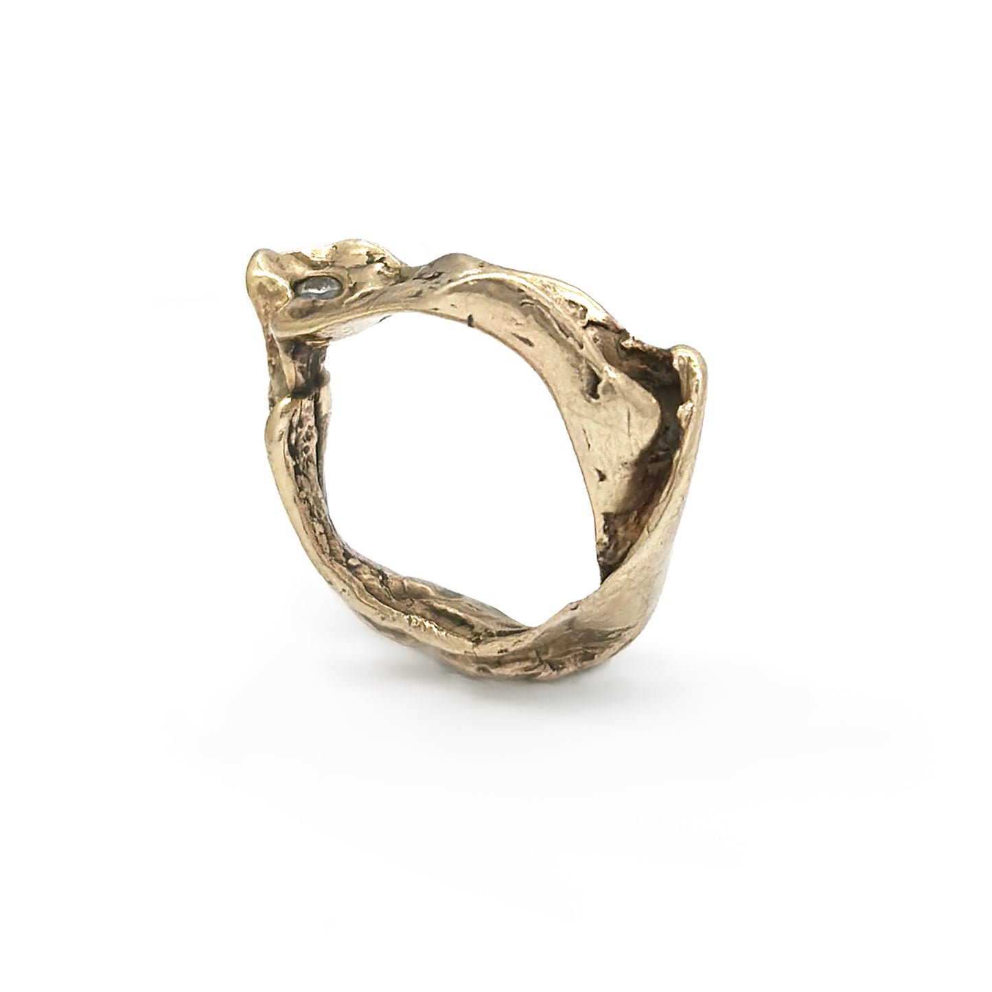 Introducing the Caracoles Custom Ring by FR | Art Jewellery, a gold-plated piece with a distinctive coiled snake design. The detailed head of the snake features a small, round gemstone as its eye, and the ring's overall rough and organic texture enhances its unique appearance. Part of our handmade jewellery collection, it stands out beautifully against a plain white background.