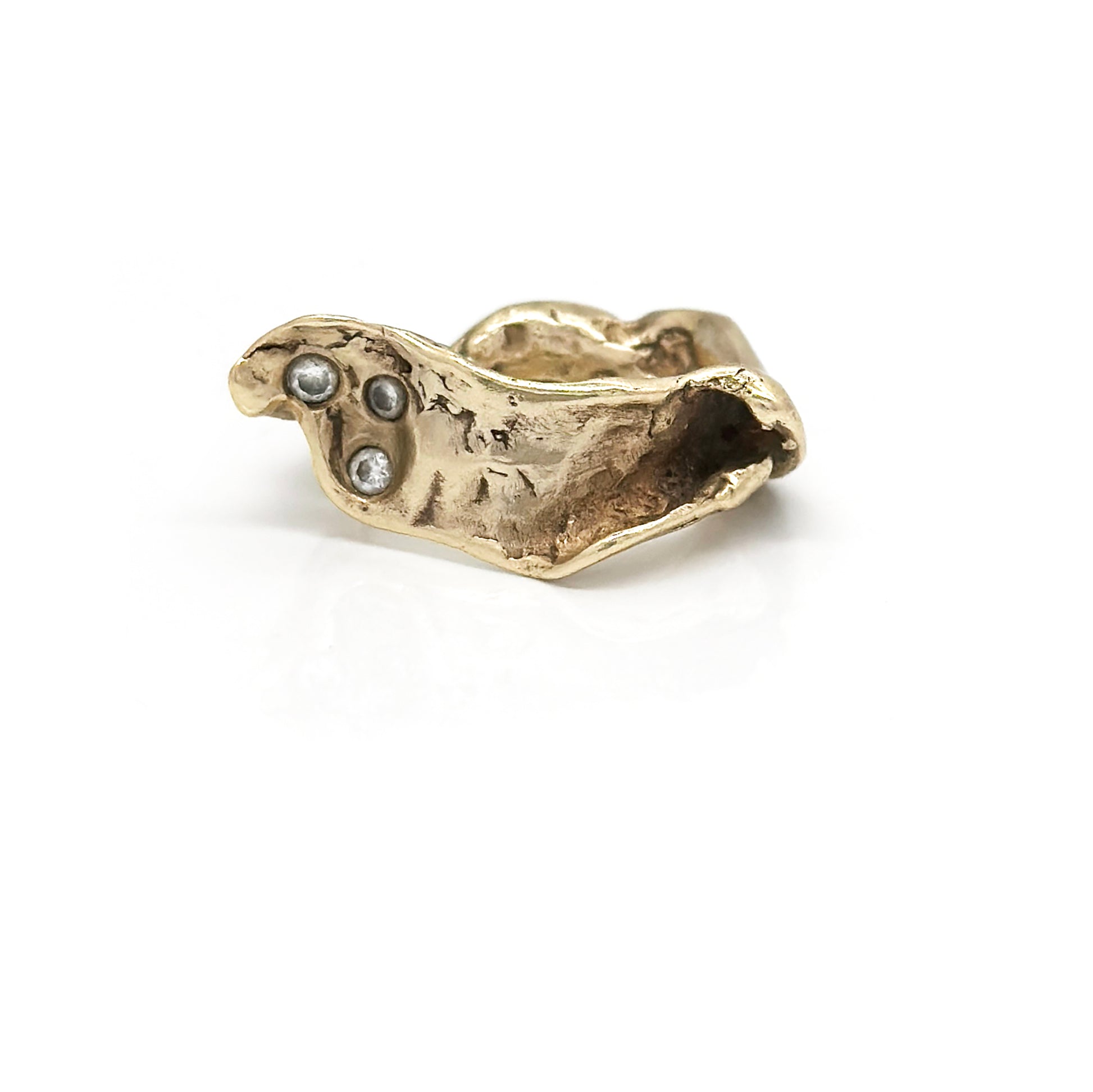 Introducing the Caracoles Custom Ring by FR | Art Jewellery, a gold-plated piece with a distinctive coiled snake design. The detailed head of the snake features a small, round gemstone as its eye, and the ring's overall rough and organic texture enhances its unique appearance. Part of our handmade jewellery collection, it stands out beautifully against a plain white background.