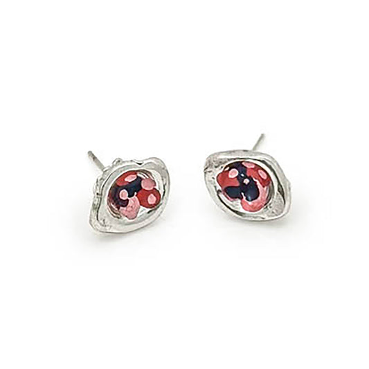 A pair of small Colour Dot Earrings Flower by FR | Art Jewellery featuring a silver base with a red and black ladybug design at the center, set against a white background. The earrings are positioned with their posts facing upwards at an angle.