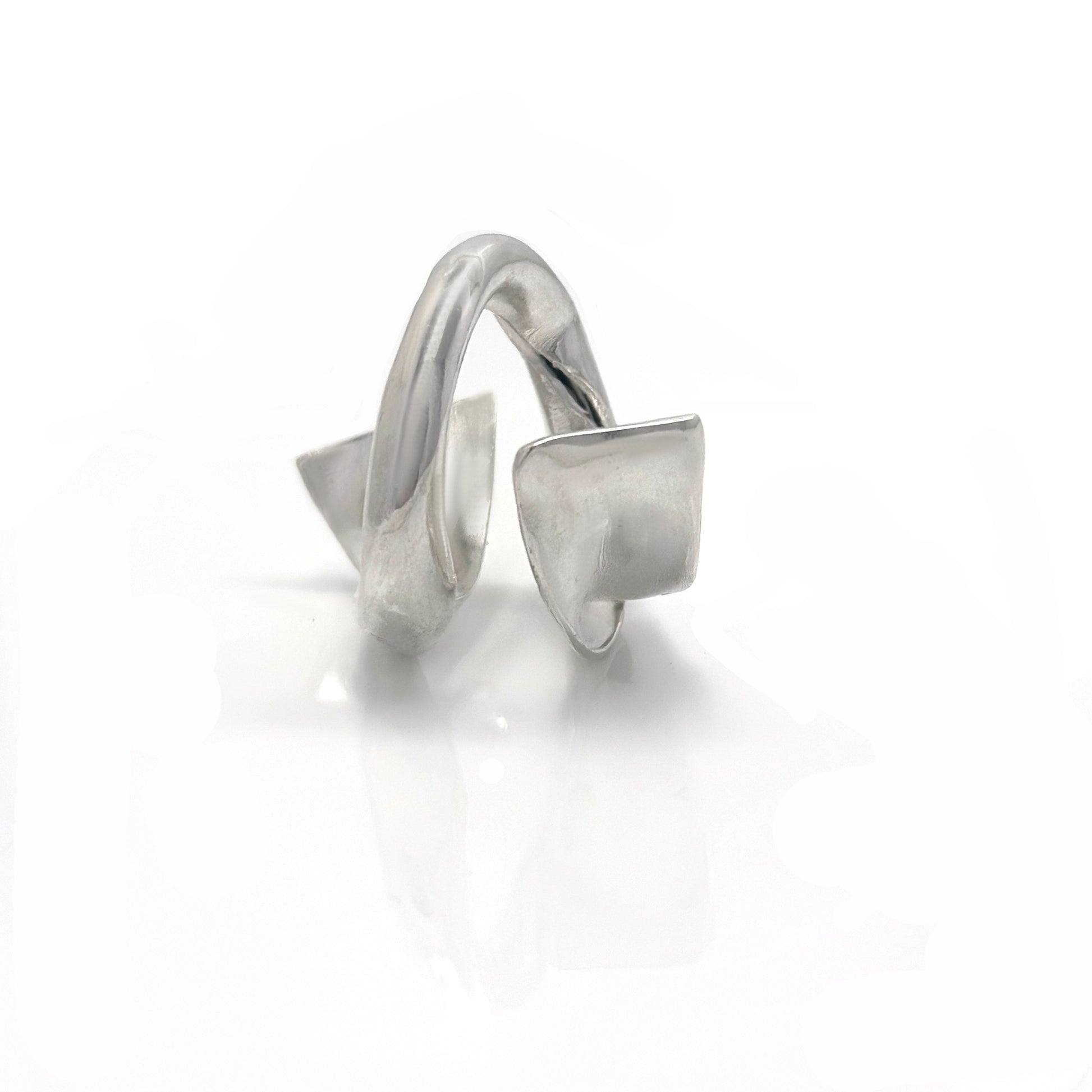 Handcrafted sterling silver ring with a fluid, convex sculptural design inspired by ocean movement – FR Art Jewellery. front look