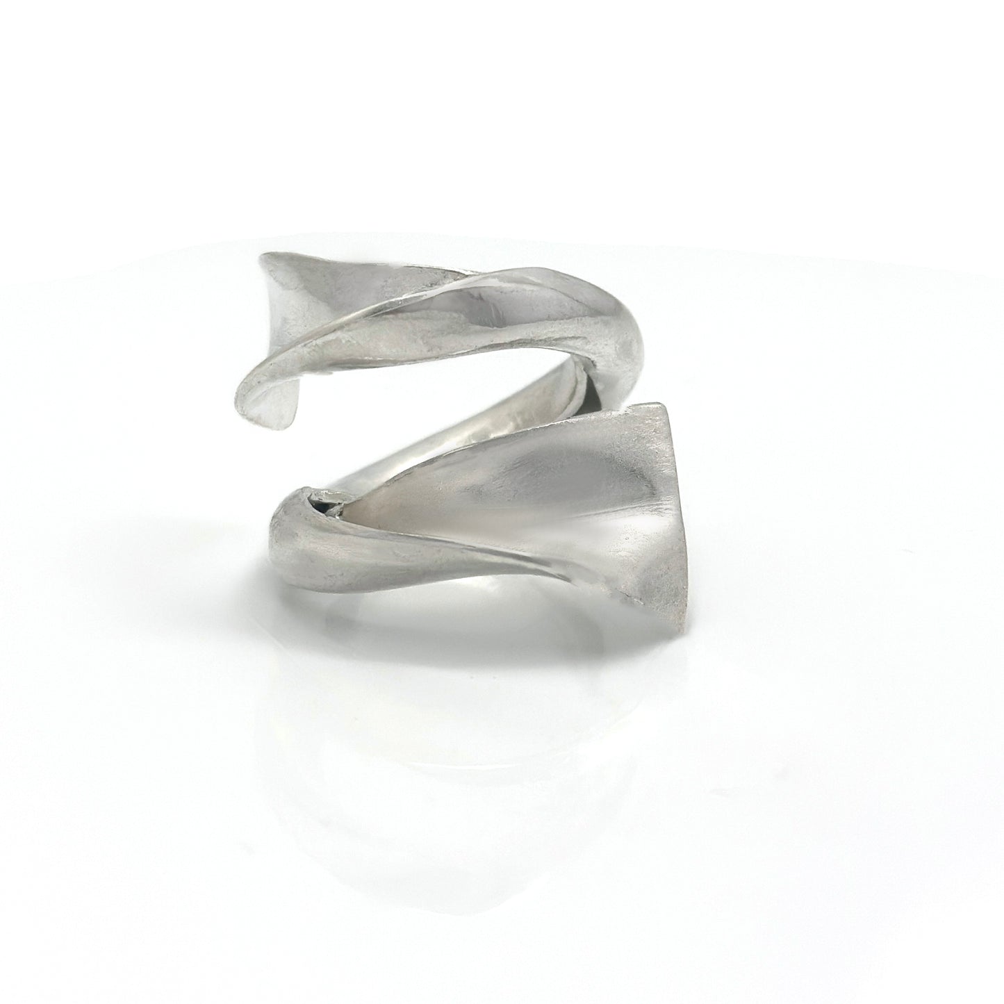 Handcrafted sterling silver ring with a fluid, convex sculptural design inspired by ocean movement – FR Art Jewellery.