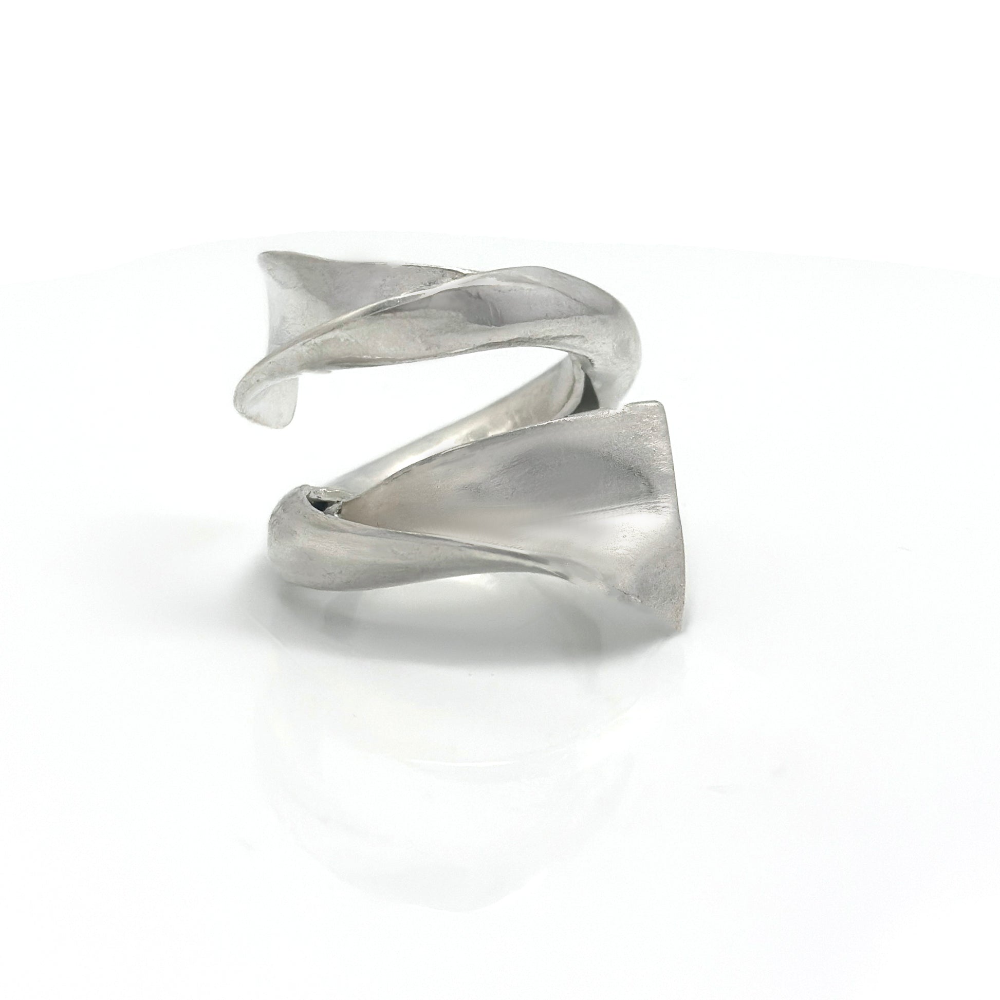Handcrafted sterling silver ring with a fluid, convex sculptural design inspired by ocean movement – FR Art Jewellery.