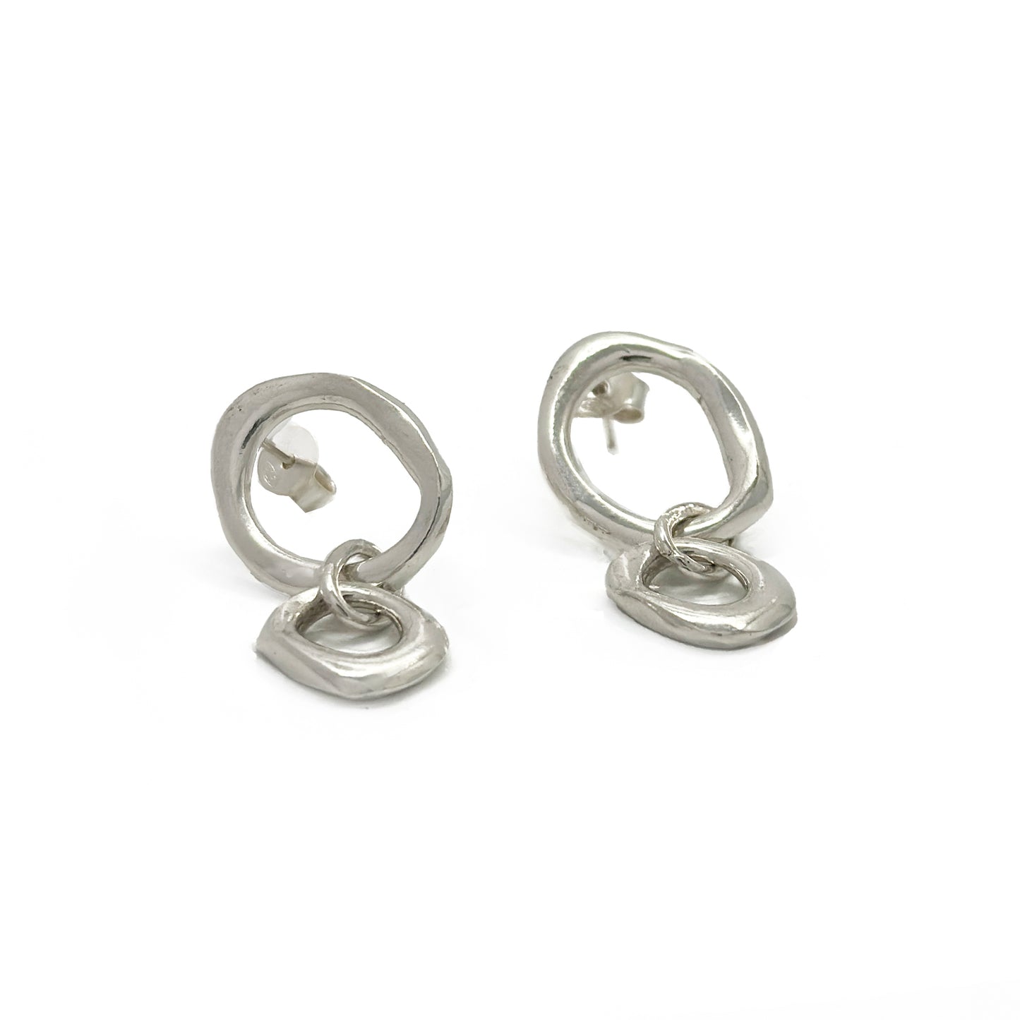 Sterling silver handcrafted sculptural earrings with circular studs and abstract linked drops by FR Art Jewellery.