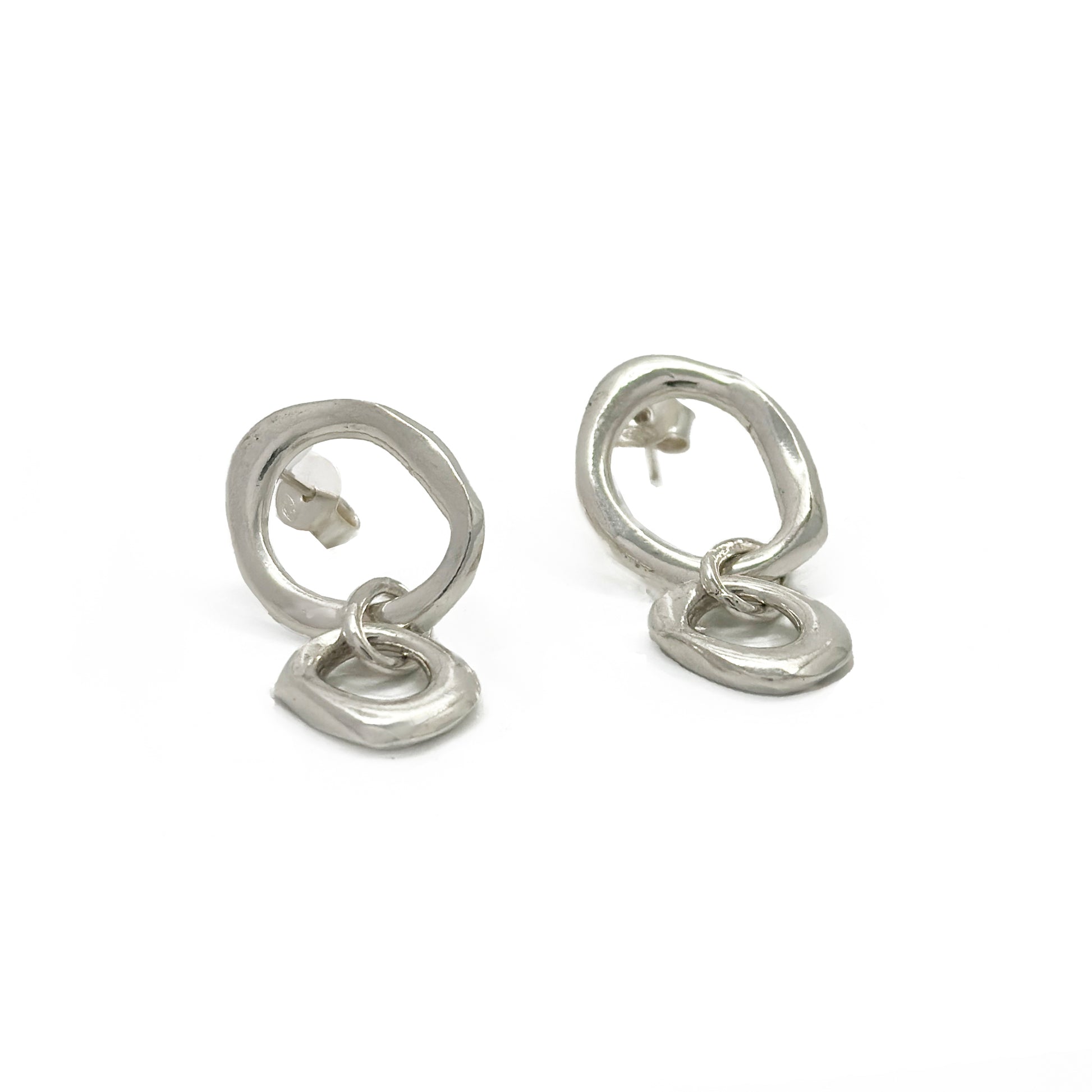 Sterling silver handcrafted sculptural earrings with circular studs and abstract linked drops by FR Art Jewellery.