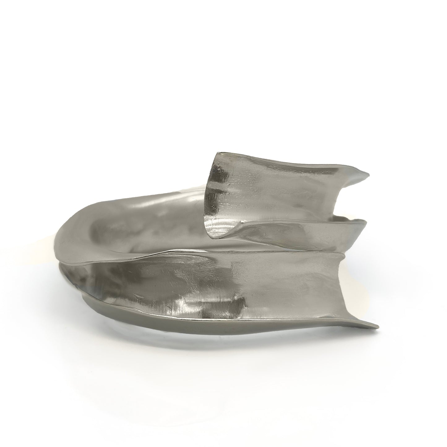 The Ebbs & Flows Bangle by FR | Art Jewellery features a twisting, asymmetrical design in polished sterling silver—a striking piece of contemporary jewellery showcased against a white background.