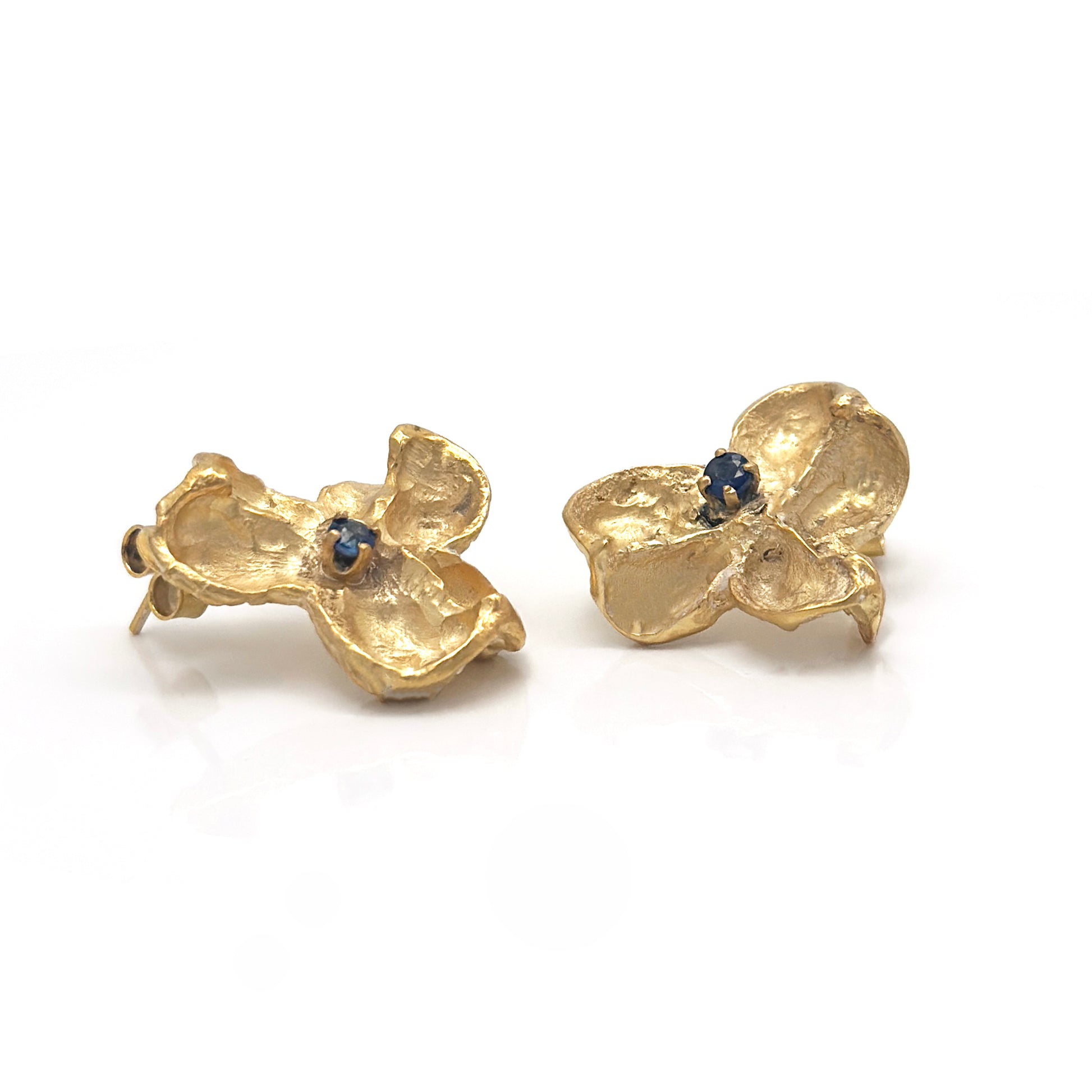 Gold-plated sterling silver sculptural stud earrings inspired by Flindersia seed pods with blue sapphires set in the centre — handmade by FR Art Jewellery. side look
