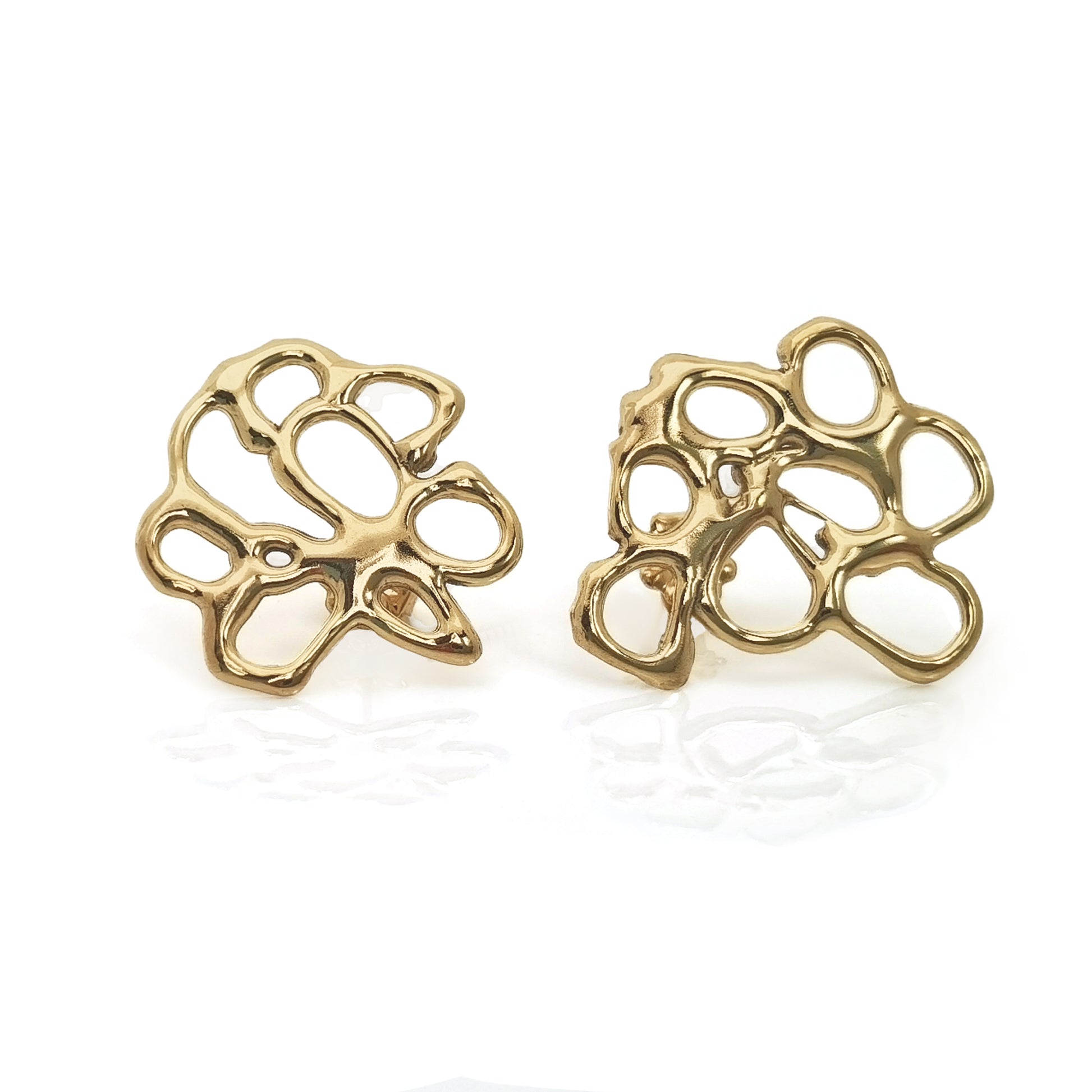 A pair of intricately designed, handmade gold Flower Earrings from FR | Art Jewellery featuring an abstract cut-out pattern. The earrings boast an organic, fluid shape with irregular open spaces, creating a modern and artistic appearance against a white background.