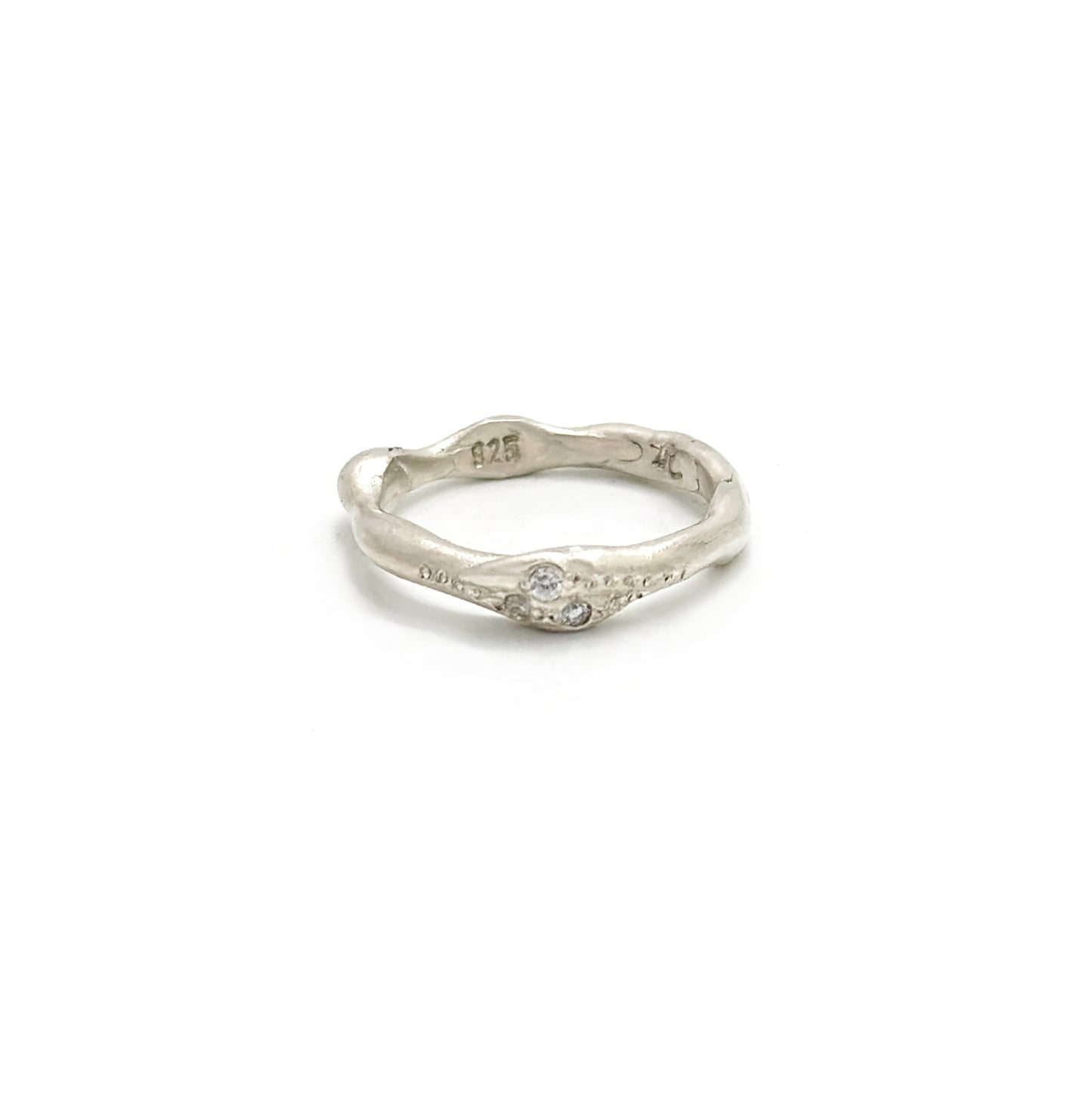 Handmade sterling silver ring with three white diamonds by FR | Art Jewellery, Sydney – organic sculptural band with natural curves and polished finish.