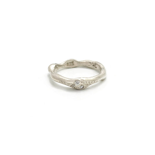 Handmade sterling silver ring with three white diamonds by FR | Art Jewellery, Sydney – organic sculptural band with natural curves and polished finish.