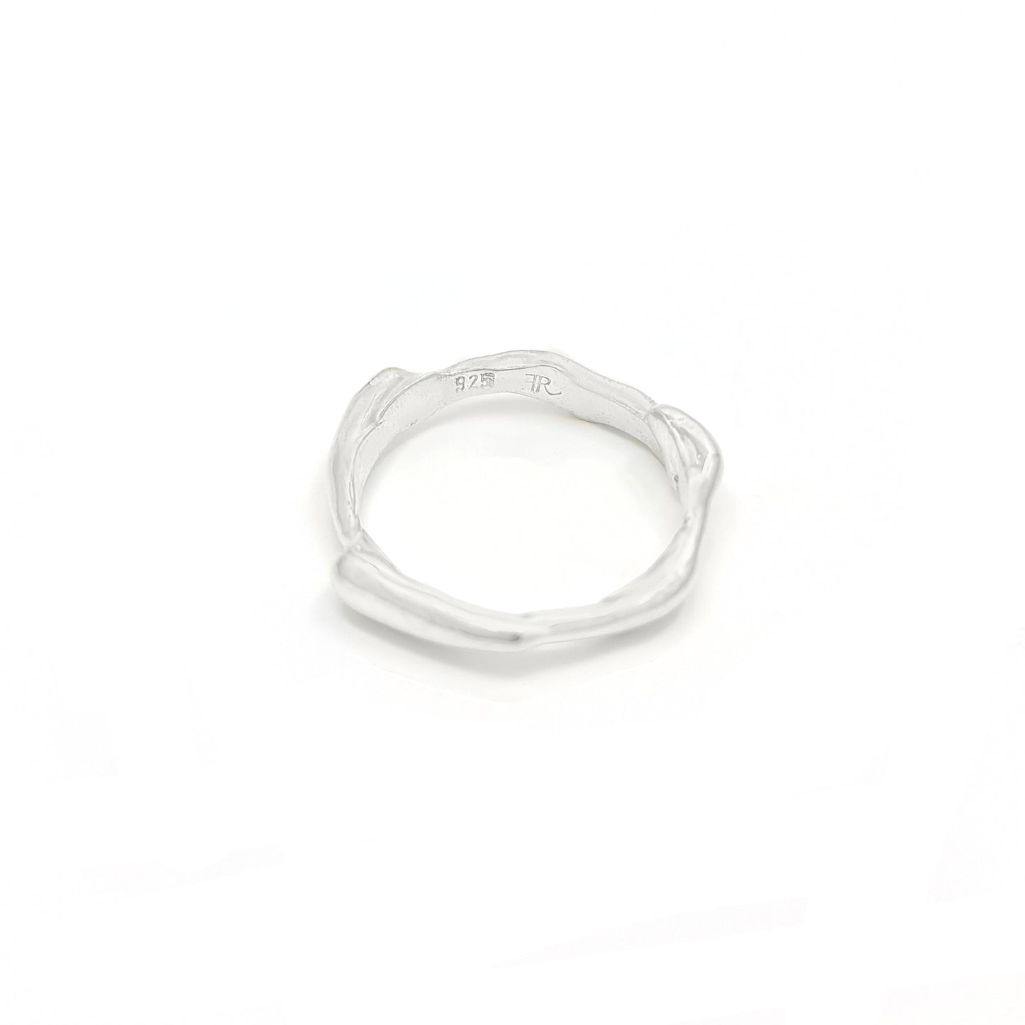 The Freedom Ring by FR | Art Jewellery showcases a captivating gold design with an irregular, organic shape and small bulbous protrusions around the band. This unique piece features an artisanal aesthetic set against a plain white background.