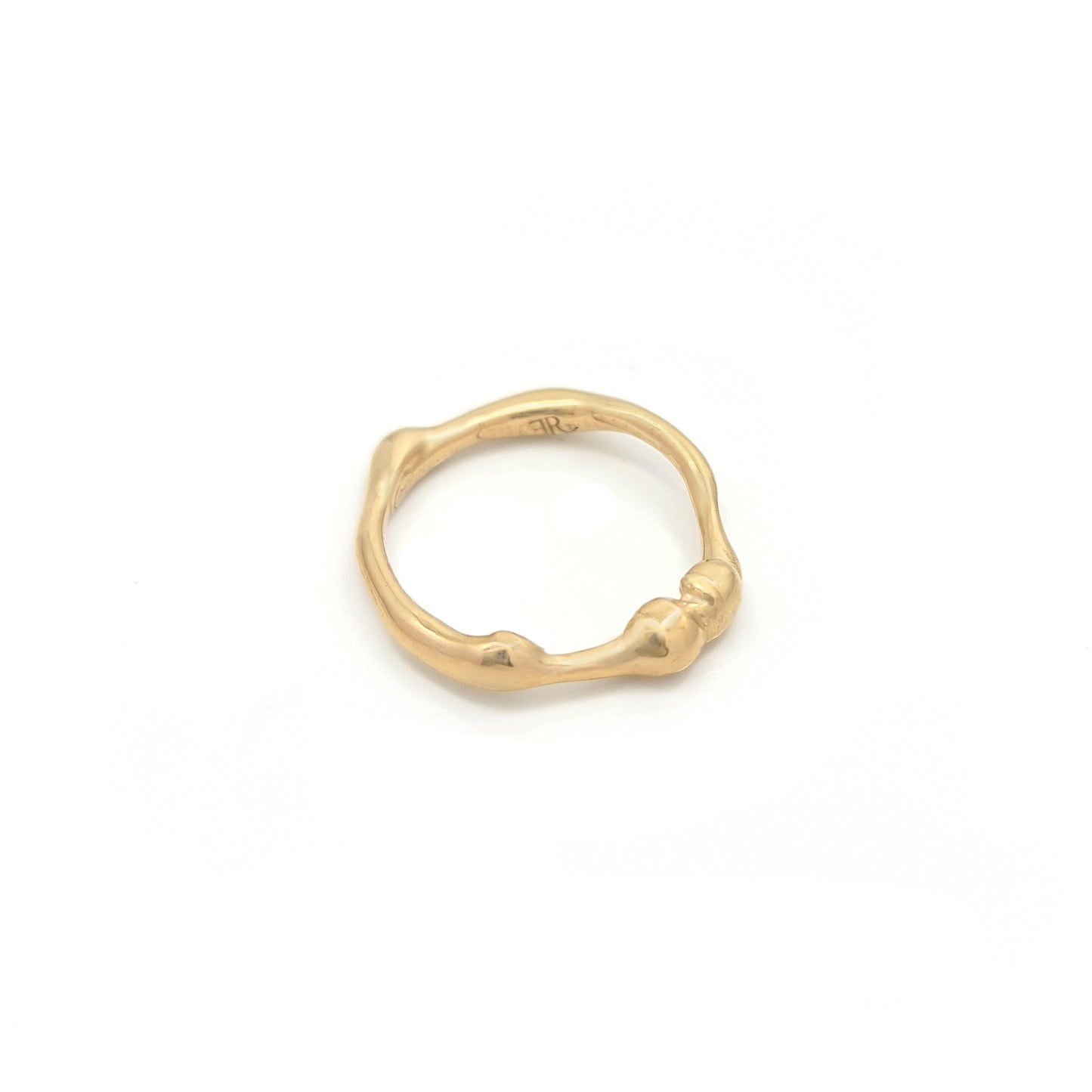 The Freedom Ring by FR | Art Jewellery showcases a captivating gold design with an irregular, organic shape and small bulbous protrusions around the band. This unique piece features an artisanal aesthetic set against a plain white background.