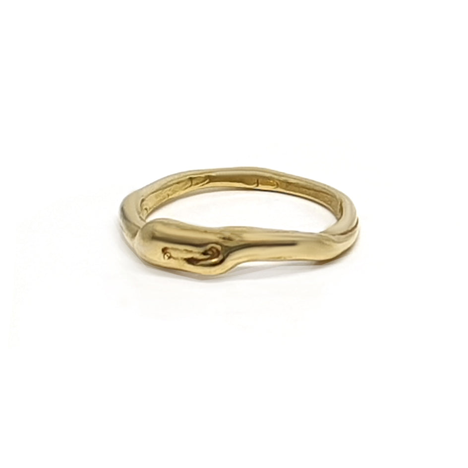 A golden ring with an organic, irregular design featuring a smooth, wavy surface. The ring has a polished finish, giving it a shiny and reflective appearance. The overall shape is slightly uneven, adding a unique and artistic touch to its style.