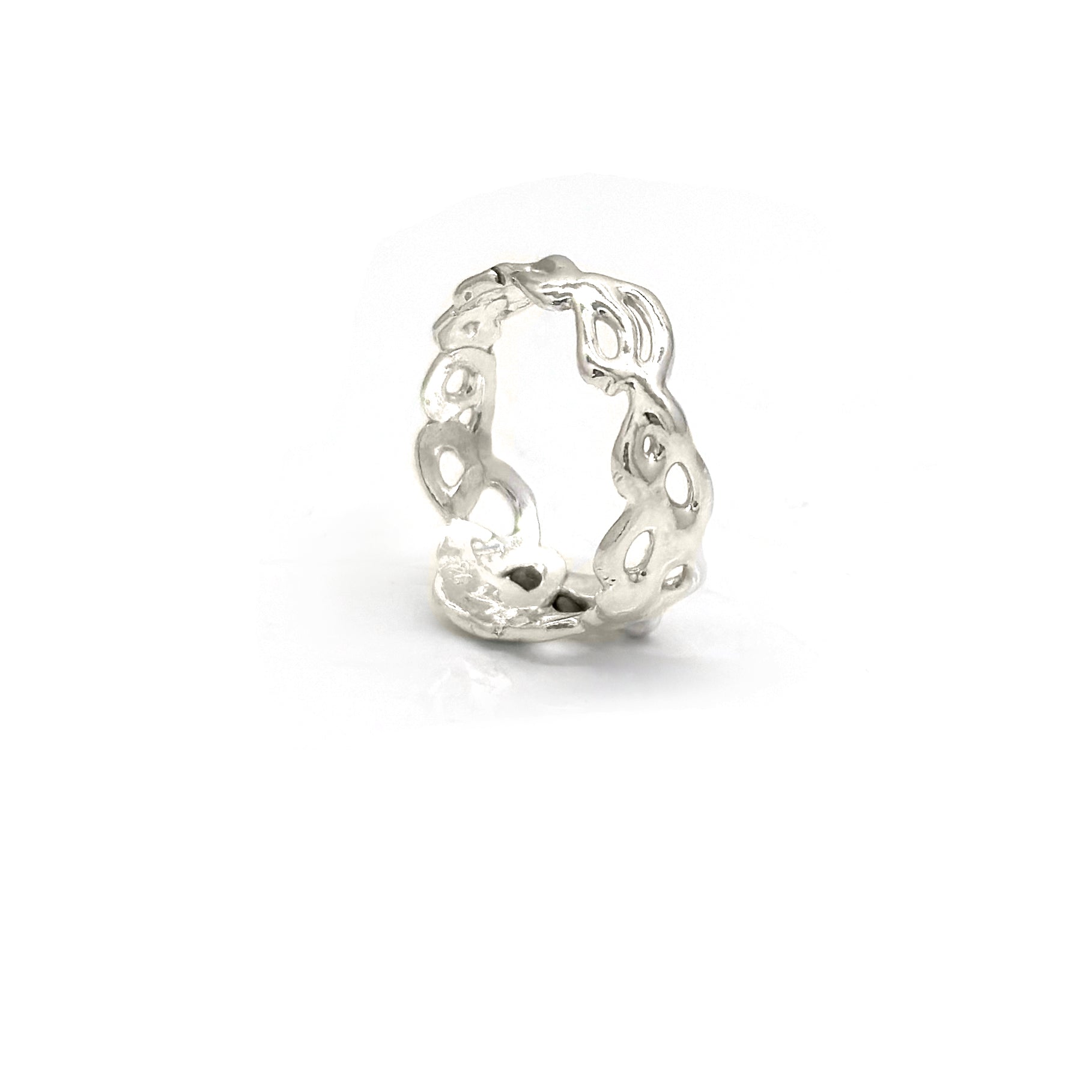 Introducing the Glimpse V3 Ring by FR | Art Jewellery, a delicate silver piece that showcases an intricate cut-out design with entwining patterns and small flowers. This handmade ring features a polished finish, enhancing its elegant appearance.