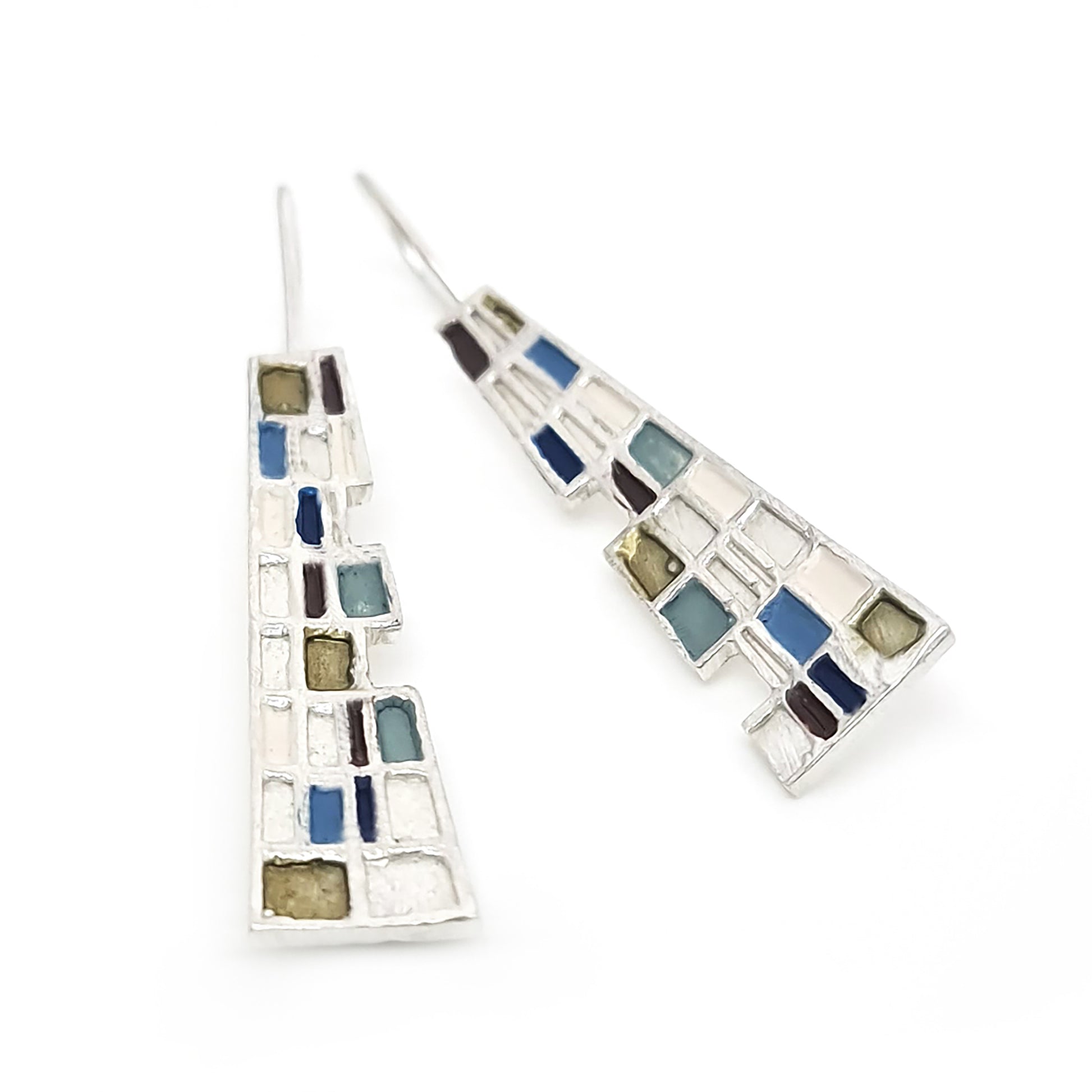 Introducing the Gustav Small Earrings by FR | Art Jewellery: A pair of handmade, dangling earrings showcasing a mosaic design with tiny squares and rectangles in a vibrant array of blue, green, purple, and beige. These silver-set earrings offer a geometric and modern aesthetic, making them perfect for custom-made orders.