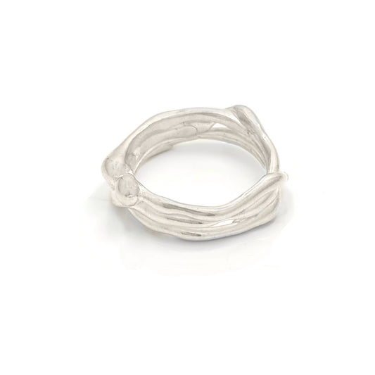 The Freedom Infinite Ring by FR | Art Jewellery is a sterling silver masterpiece designed to resemble intertwined branches, showcasing unique craftsmanship for a natural and organic look.