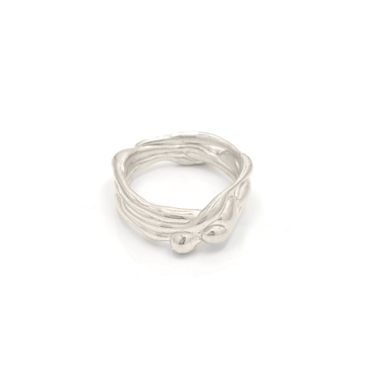 The Freedom Infinite Ring by FR | Art Jewellery is a sterling silver masterpiece designed to resemble intertwined branches, showcasing unique craftsmanship for a natural and organic look.