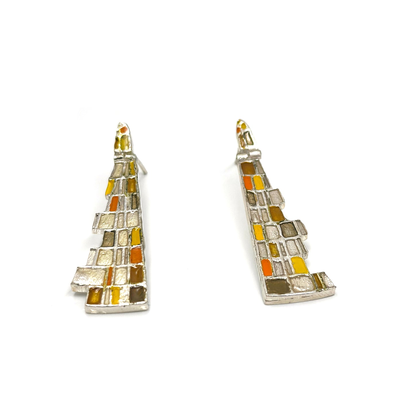 The Klimt Earrings by FR | Art Jewellery feature geometric building-inspired shapes in enamel-painted sterling silver, with blue, turquoise, gold, and white inlays. Displayed on a white background.
