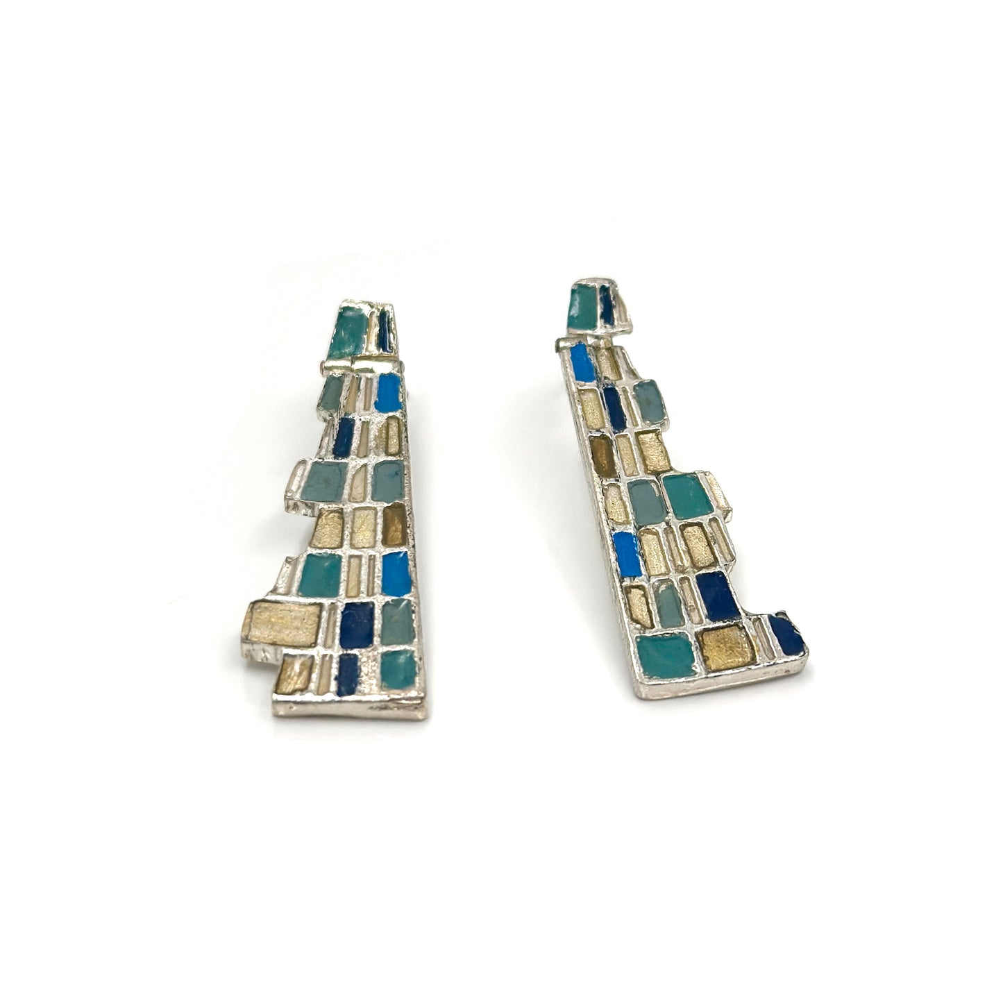 The Klimt Earrings by FR | Art Jewellery feature geometric building-inspired shapes in enamel-painted sterling silver, with blue, turquoise, gold, and white inlays. Displayed on a white background.