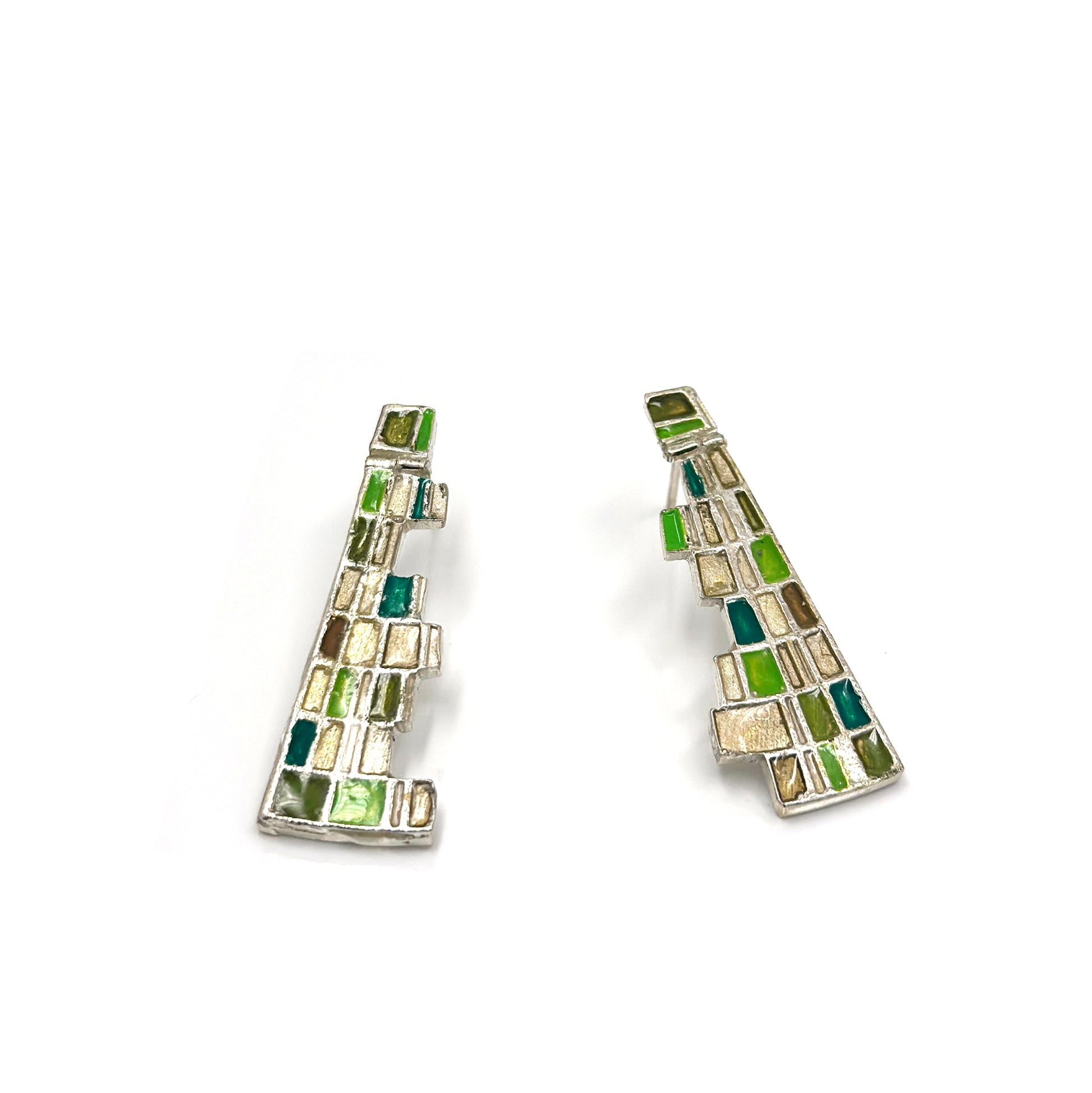 The Klimt Earrings by FR | Art Jewellery feature geometric building-inspired shapes in enamel-painted sterling silver, with blue, turquoise, gold, and white inlays. Displayed on a white background.