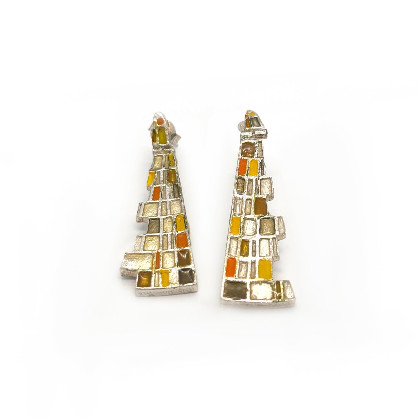 The Klimt Earrings by FR | Art Jewellery feature geometric building-inspired shapes in enamel-painted sterling silver, with blue, turquoise, gold, and white inlays. Displayed on a white background.