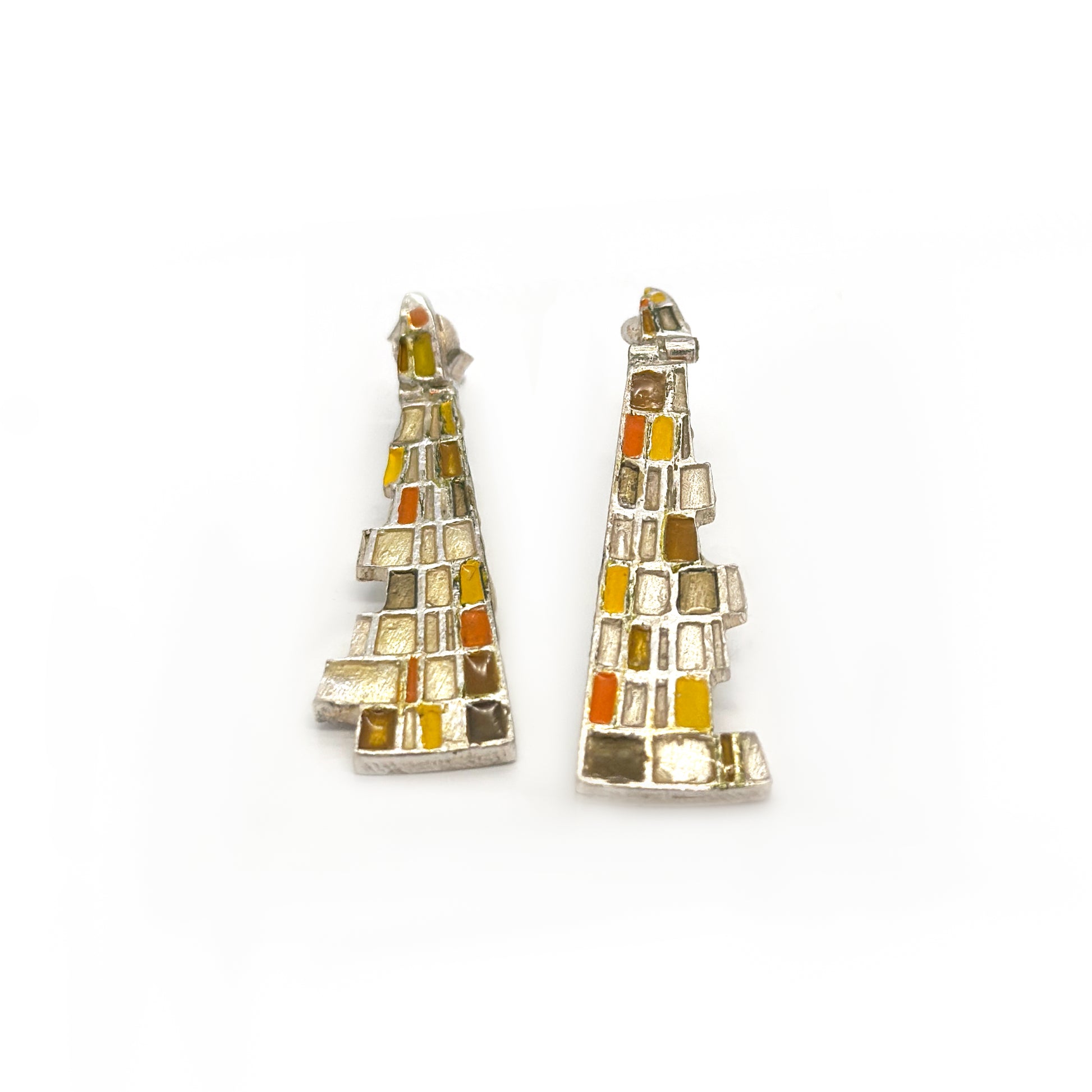 The Klimt Earrings by FR | Art Jewellery feature geometric building-inspired shapes in enamel-painted sterling silver, with blue, turquoise, gold, and white inlays. Displayed on a white background.
