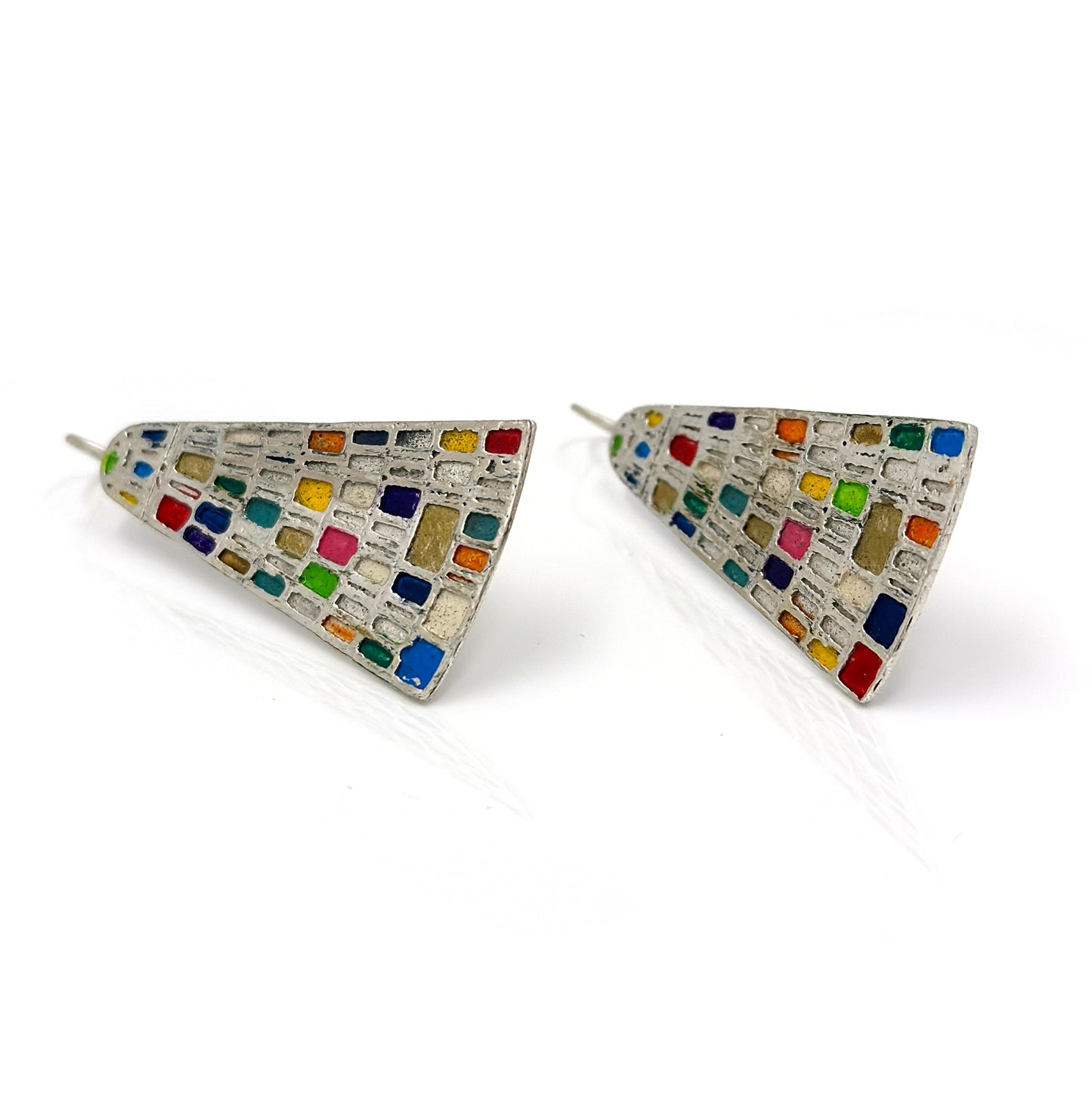 Introducing the Klimt Colours Earrings from FR | Art Jewellery: a stunning pair of silver earrings featuring a distinctive triangular shape. Each piece is adorned with an array of small, colorful mosaic tiles in vibrant hues such as blue, green, red, yellow, and orange. These handmade earrings are designed with hooks for easy fastening and boast a symmetrical design against a plain white background.